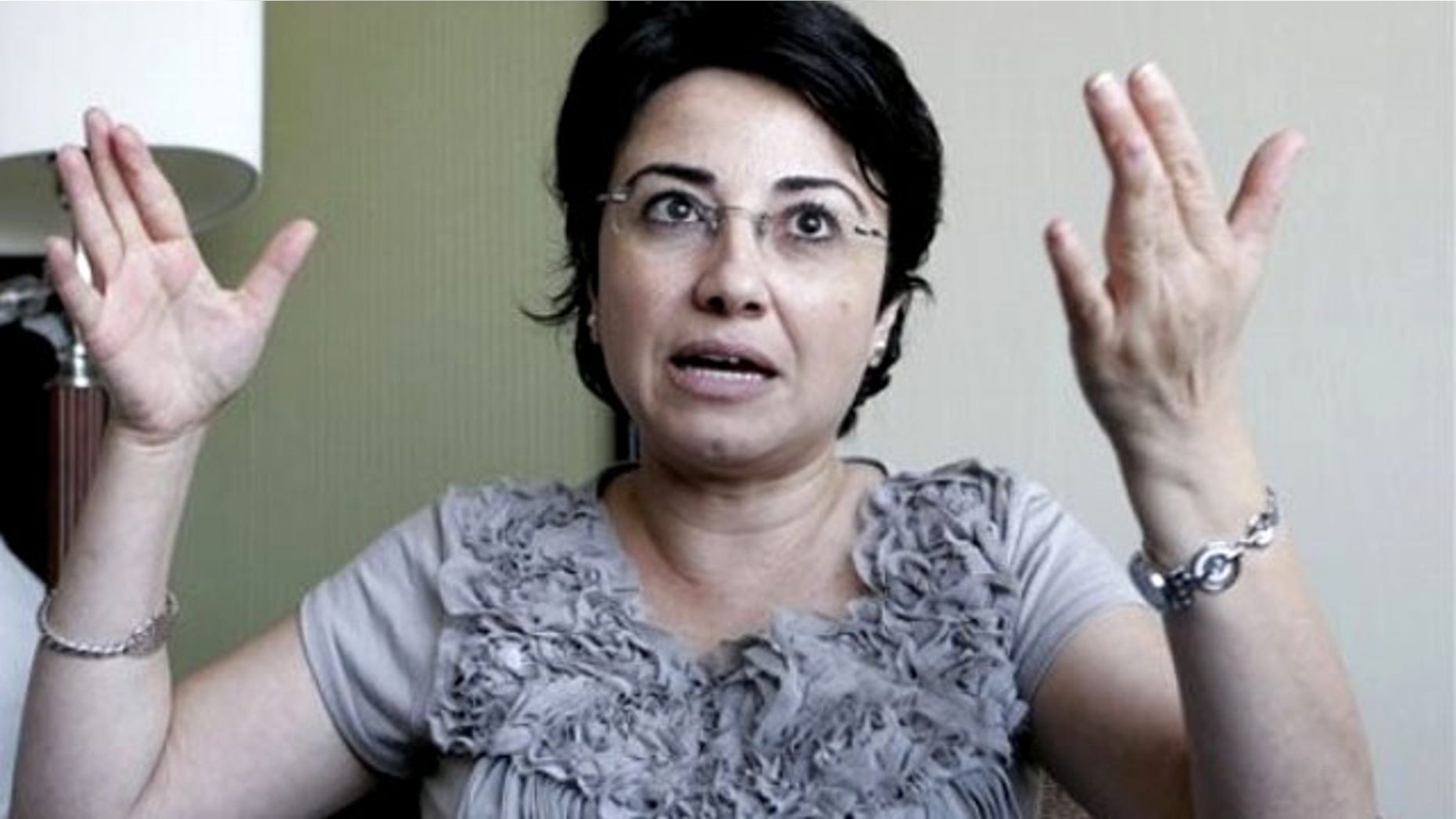 Israeli-Arab Knesset member Hanin Zoabi gestures as she talks to the media in Amman, Jordan, Tuesday, Aug. 31, 2010, after being interviewed by investigators from a U.N. human rights inquiry on the May 31 flotilla attack.