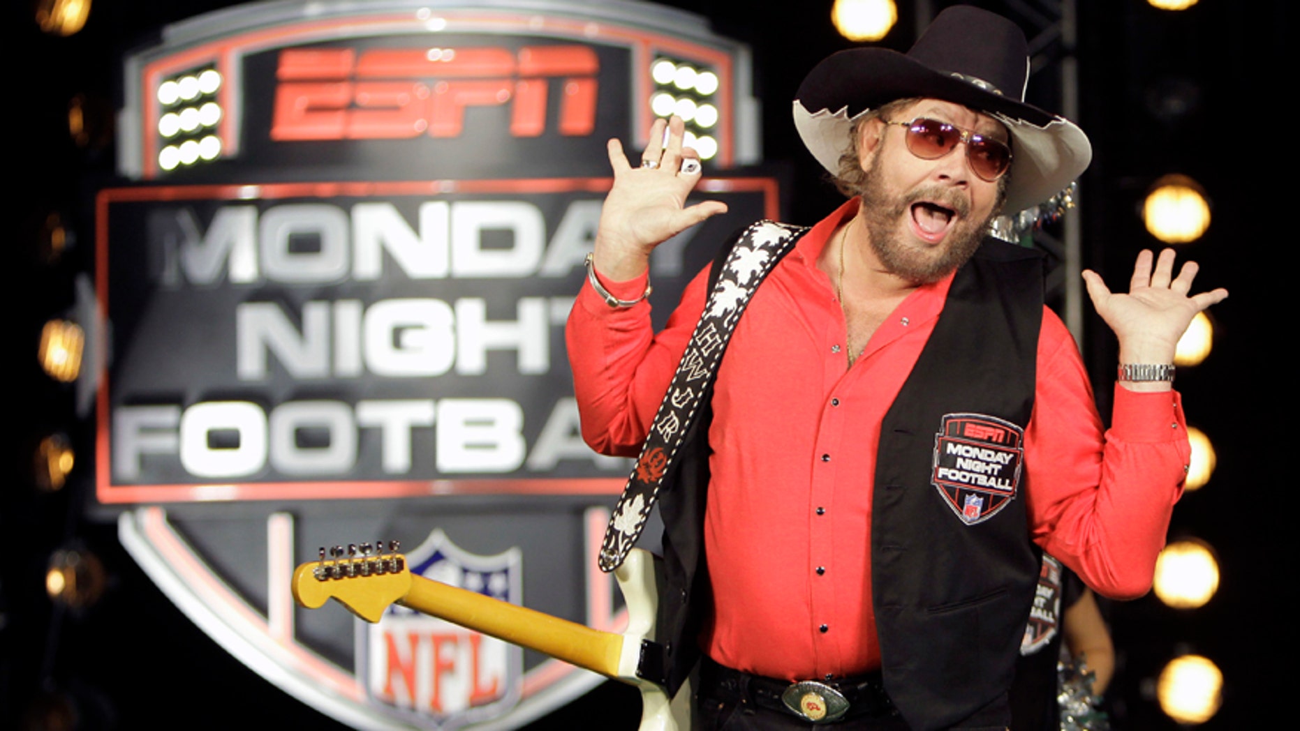 In this July 14, 2011, file photo, Hank Williams Jr. performs during the recording of a promo for NFL Monday Night Football in Winter Park, Fla.