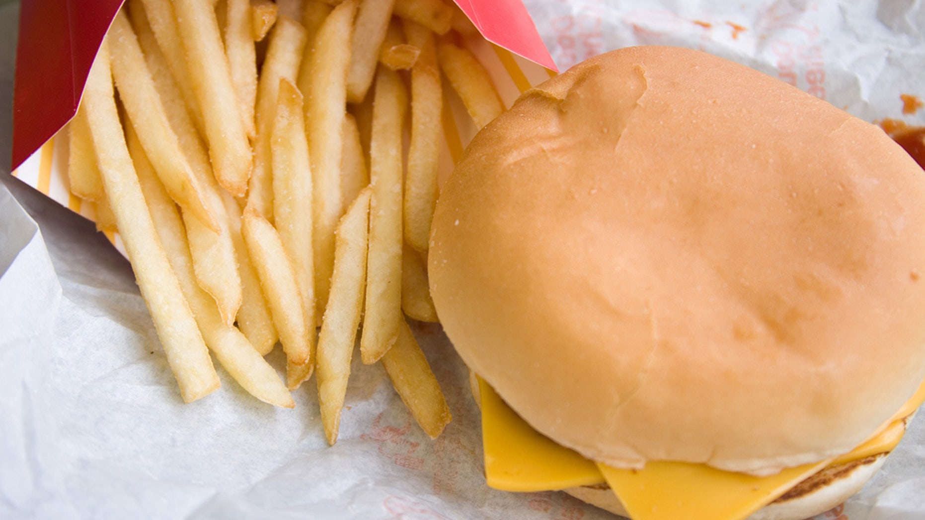 Fast food wrappers contains chemicals that have recently been linked to slowing down metabolism.