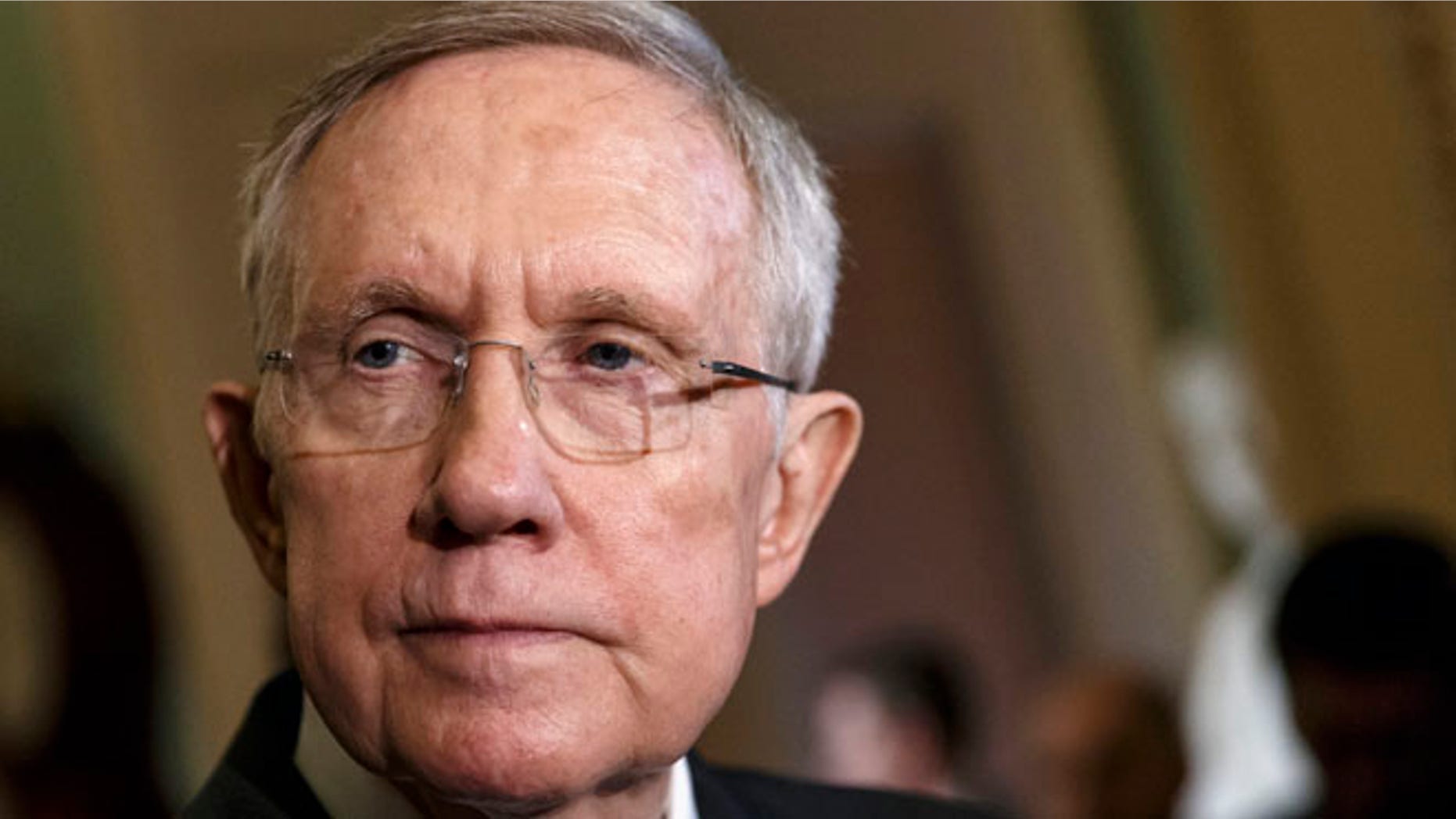 This April 29, 2014 file photo shows Senate Majority Leader Harry Reid of Nev. talking to reporters on Capitol Hill in Washington.