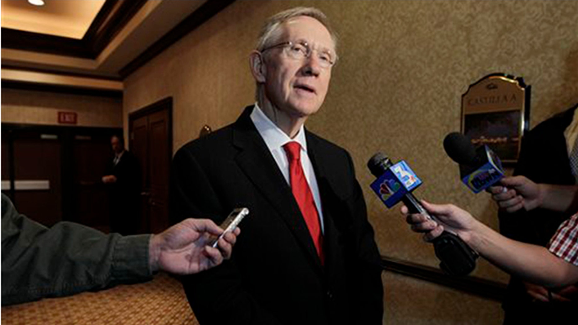 This Aug. 25, 2010 file photo U.S. Sen. Majority Leader Harry Reid answers questions for a member of the media in Las Vegas, Nev.(AP Photo/Julie Jacobson,File)