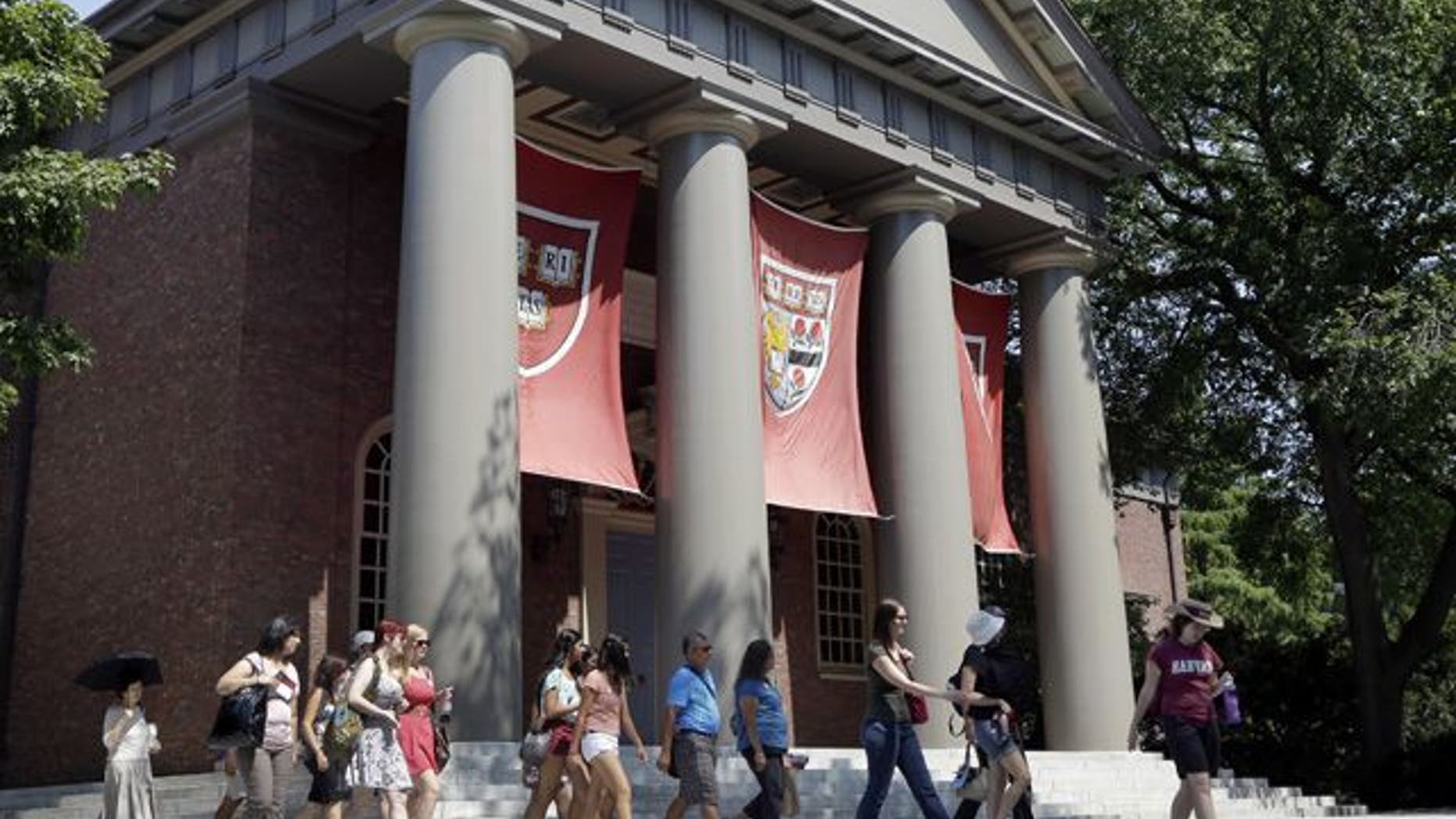 Aug. 30, 2012: People are led on a tour group at the campus of Harvard University in Cambridge, Mass.