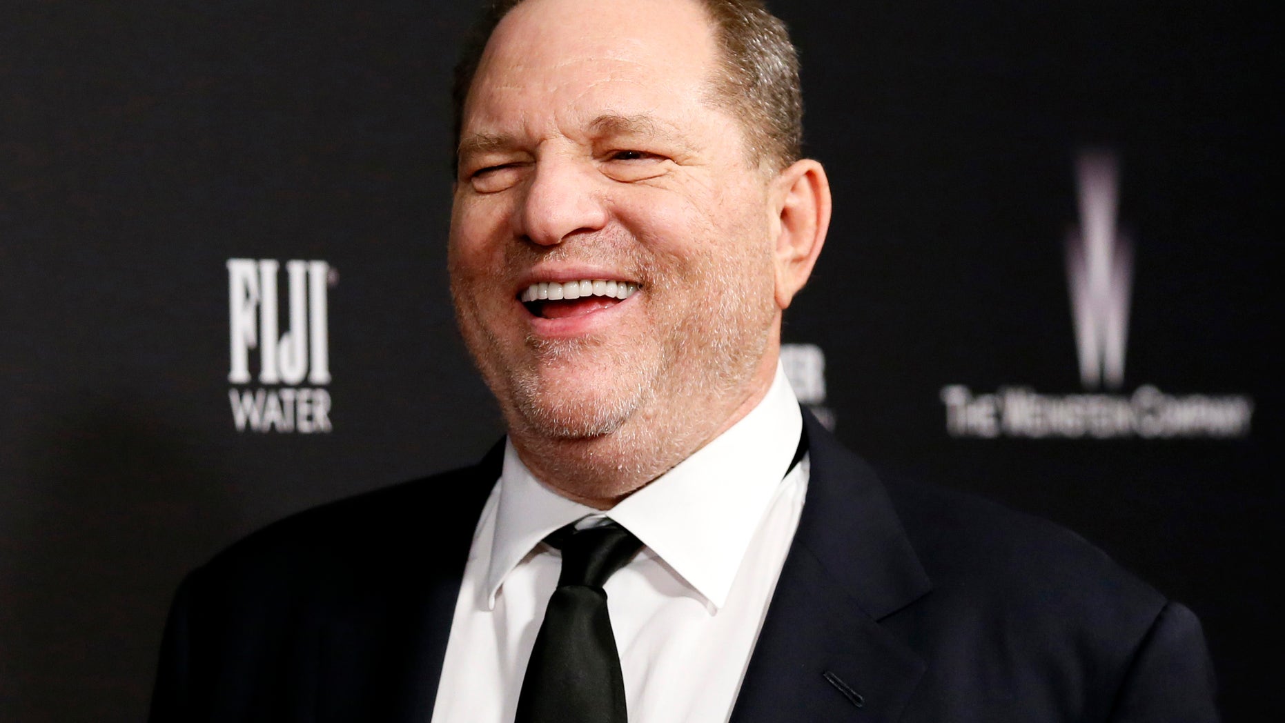 Producer Harvey Weinstein, pictured here at The Weinstein Company and Netflix's 2014 Golden Globes after party, reportedly hired lawyers to combat upcoming articles by The New York Times and The New Yorker.