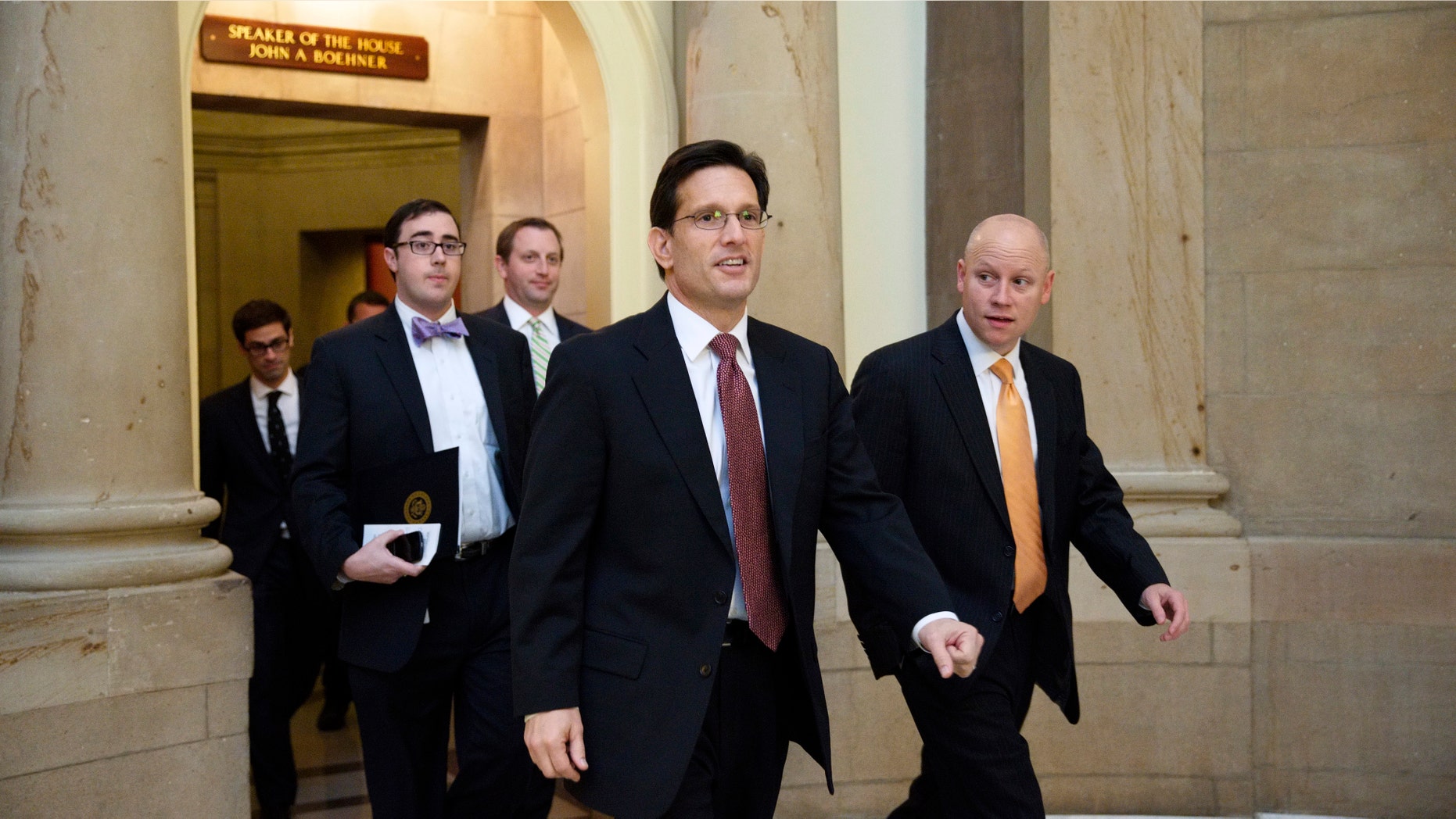House Majority Leader Eric Cantor of Va., center, leaves the office of House Speaker John Boehner of Ohio, on Capitol Hill in Washington, Friday, Nov. 15, 2013, before a vote on a measure to let insurers keep offering health coverage that falls short of the law's standards. A day earlier, the president changed course in the face of a public uproar over the flawed debut of the Affordable Care Act and said he would take administrative action â which doesn't need congressional approval â to let companies continue selling such plans for at least another year. Unlike the House GOP bill, he would permit such sales to insurers' existing customers only, not to new ones.(AP Photo/J. Scott Applewhite)