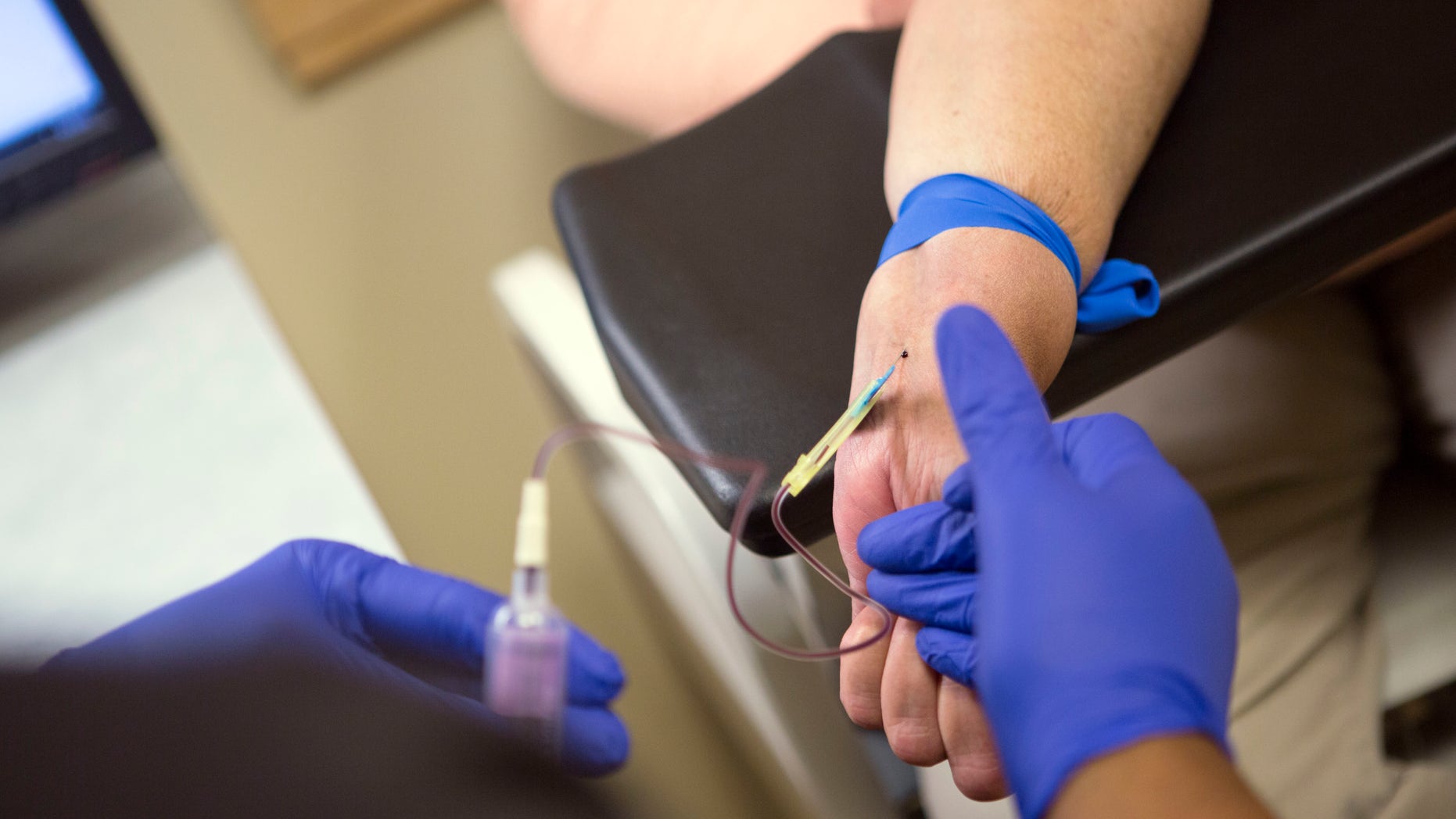 Irma Hendricks has blood drawn at the Hospital of the University of Pennsylvania in Philadelphia, on Oct. 6, 2016. Hendricks received a kidney transplant from a donor with hepatitis C, and took medications after surgery that cleared away the virus and left her feeling healthy again. Hendricks is part of a pilot study testing if new drugs that promise to cure most hepatitis C could allow use of organs that today go to waste, and speed transplants to people who might otherwise die waiting. (AP Photo/Jessica Kourkounis)
