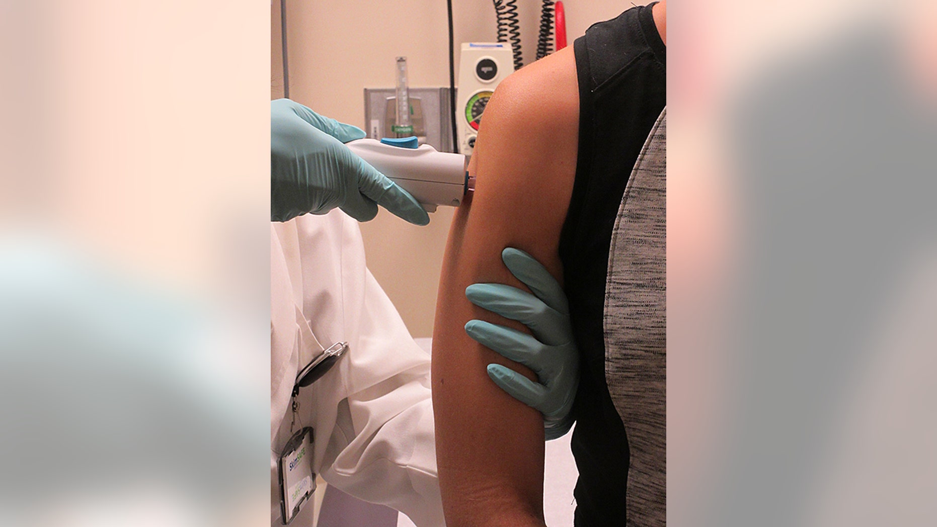 In this photo provided âby The National Institute of Allergy and Infectious Diseases shows a healthy volunteer receiving the NIAID Zika virus investigational DNA vaccine as part of an early-stage trial to test the vaccine's safety and immunogenicity. This is the first administration of this vaccine in a human. (âThe National Institute of Allergy and Infectious Diseases via AP)