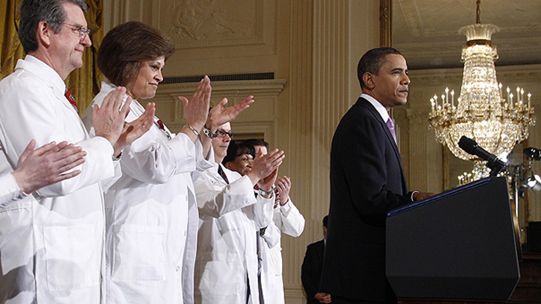 Mar. 3: Health professionals applaud as President Obama speaks about health care reform at the White House.