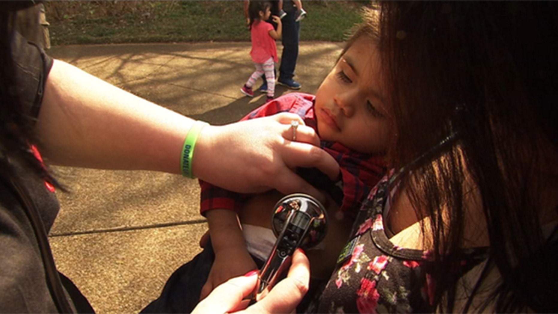 Jessica Harris hears her son Toby's heart beating in Daniel Avila's chest.