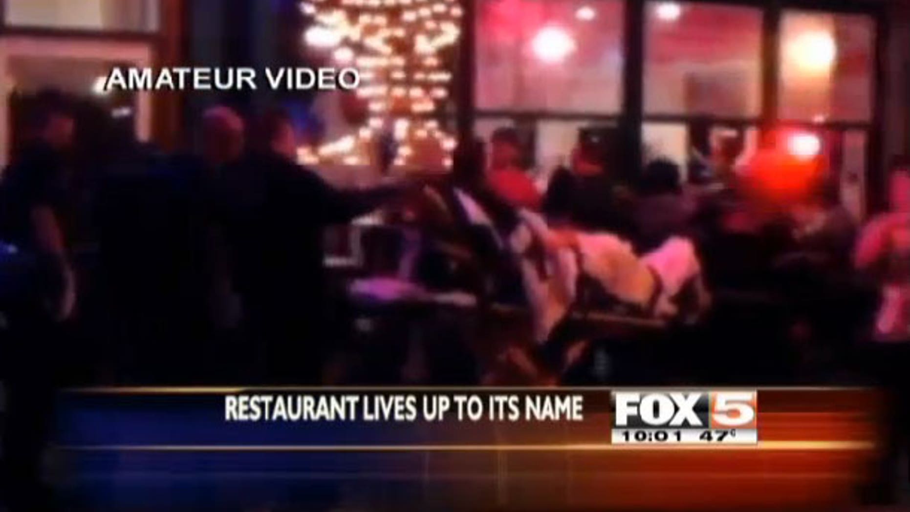 Amateur video of man being rolled out on a stretcher by EMTs after suffering a heart attack at the Heart Attack Grill in Las Vegas.