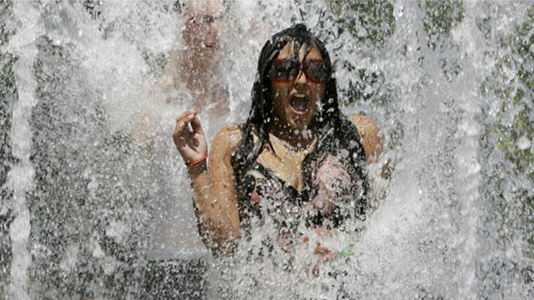 A young woman tries to escape the heat.