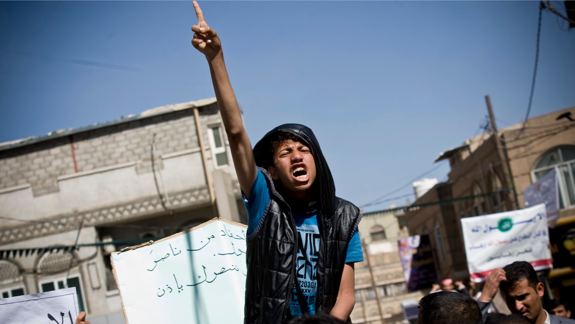 Jan. 17, 2015: A Yemeni youth chants slogans during a protest against caricatures published in French magazine Charlie Hebdo in front of the French Embassy in Sanaa, Yemen.