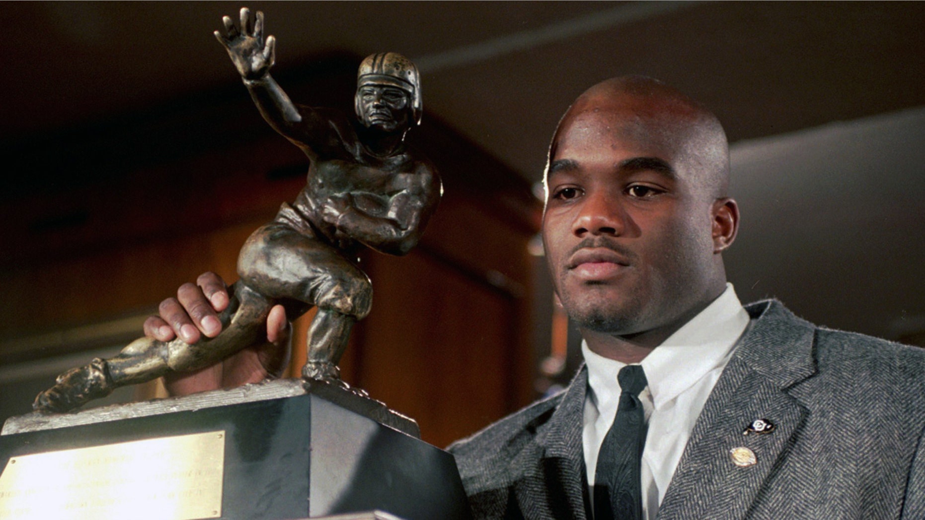 In this Dec. 10, 1994, file photo, Colorado's Rashaan Salaam poses with his 1994 Heisman Trophy at the Downtown Athletic Club in New York.