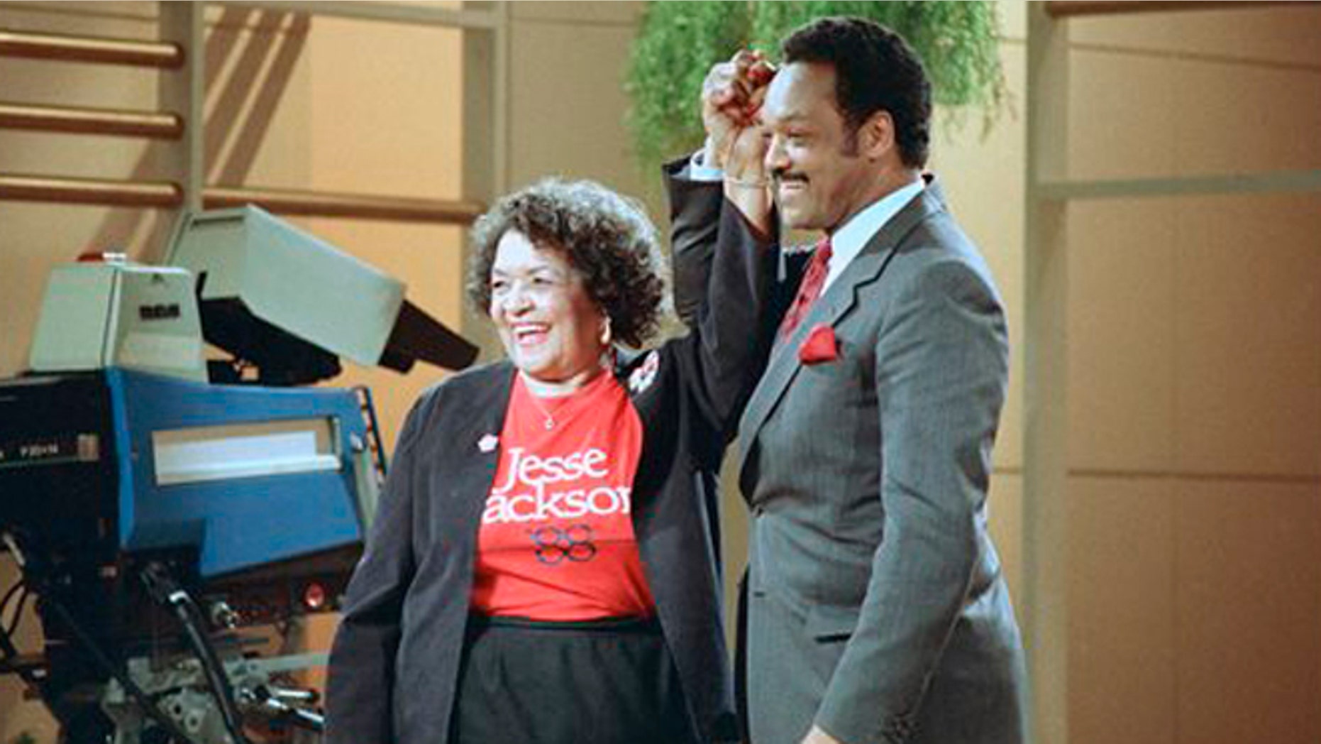 File: Democratic presidential hopeful Jesse Jackson clasps hands with his mother, Helen Jackson, during taping of the Phil Donahue show in New York.