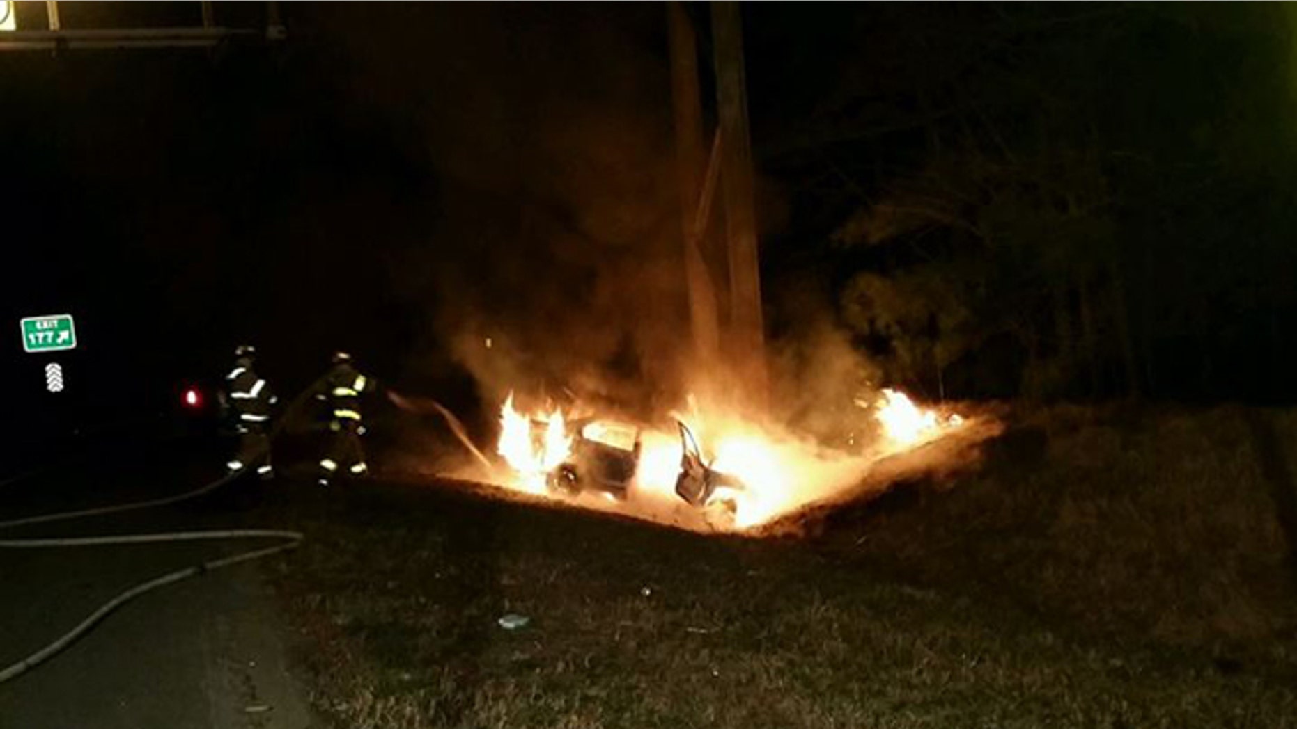 Firefighters extinguish fire on I-64 Saturday after Good Samaritan's dramatic rescue. (Henrico County Division of Fire)