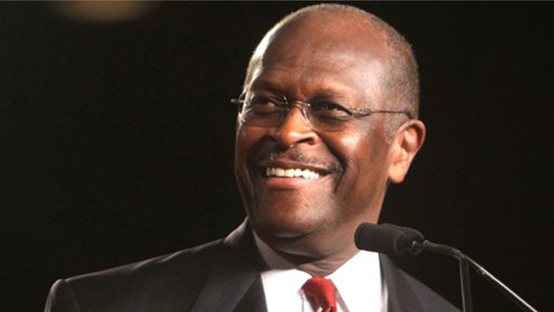Republican presidential candidate Herman Cain arrives onstage to address the Conservative Political Action Conference (CPAC) at the Orange County Convention Center in Orlando, Fla., Friday, Sept. 23, 2011.
