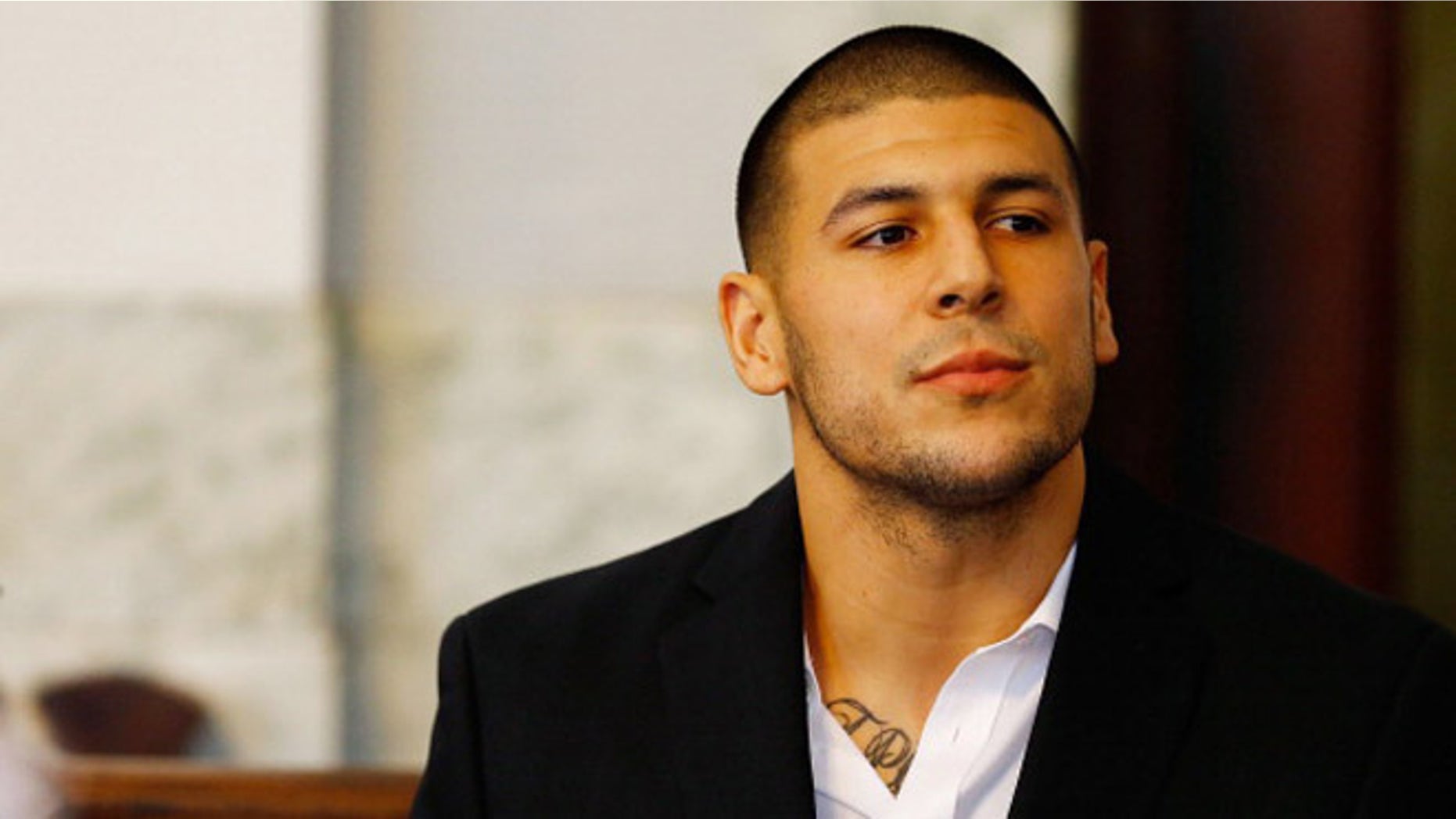 NORTH ATTLEBORO, MA - AUGUST 22: Aaron Hernandez sits in the courtroom of the Attleboro District Court during his hearing on August 22, 2013 in North Attleboro, Massachusetts.