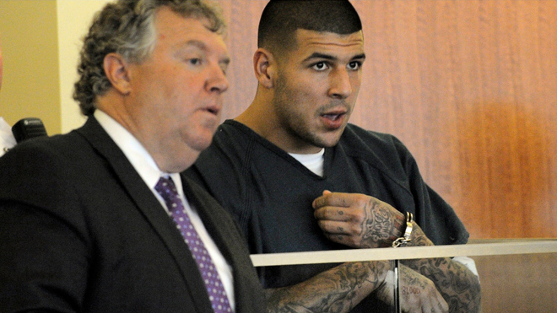 June 27, 2013: Former New England Patriots tight end Aaron Hernandez makes a court appearance in connection to the death of Odin Lloyd, a 27-year-old Boston semi-professional football player whose body was found June 17 about a mile from Hernandez's home in North Attleborough, Mass. (AP)