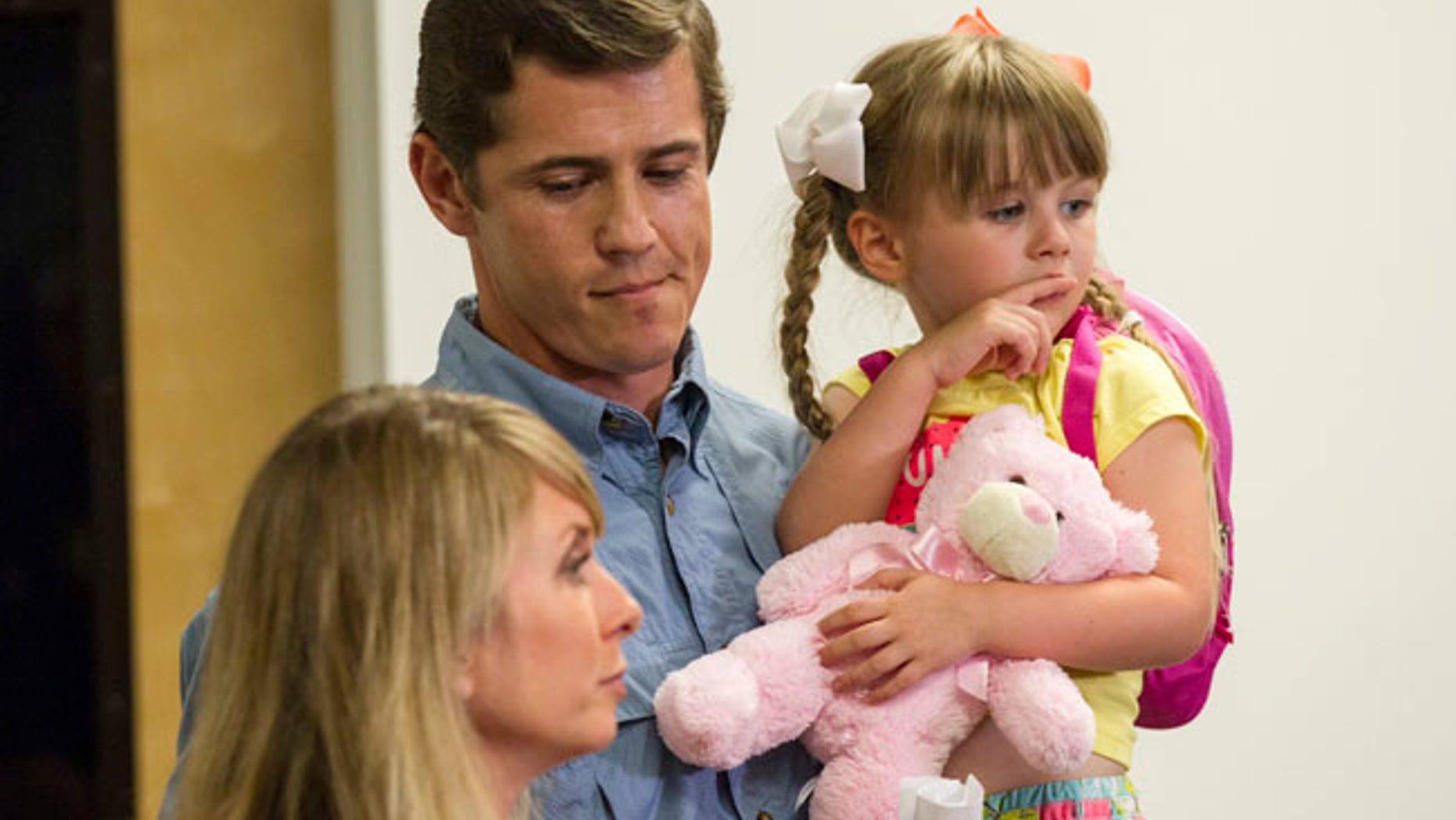 Patrick Hale, the man credited by law enforcement with forcing the surrender of two Georgia prison escapees, speaks Friday as wife Danielle looks on.