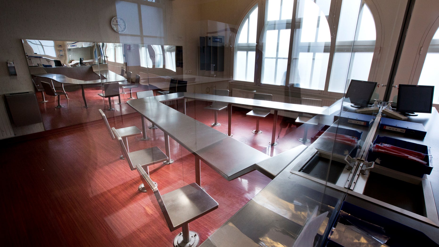 Surveillance cameras, right, are mounted underneath a metal table with chairs bolted to the floor where addicts can inhale heroin fumes in a clinic in Amsterdam, Netherlands, Tuesday, April 12, 2016. An alarming 47,000 American overdose deaths in 2014 _ 60 percent from heroin and related opioid painkillers like fentanyl _ has pushed elected leaders in New York, California and other states to consider what was once unthinkable: government-sanctioned sites where users are under the supervision of a doctor or nurse who can administer an antidote if necessary