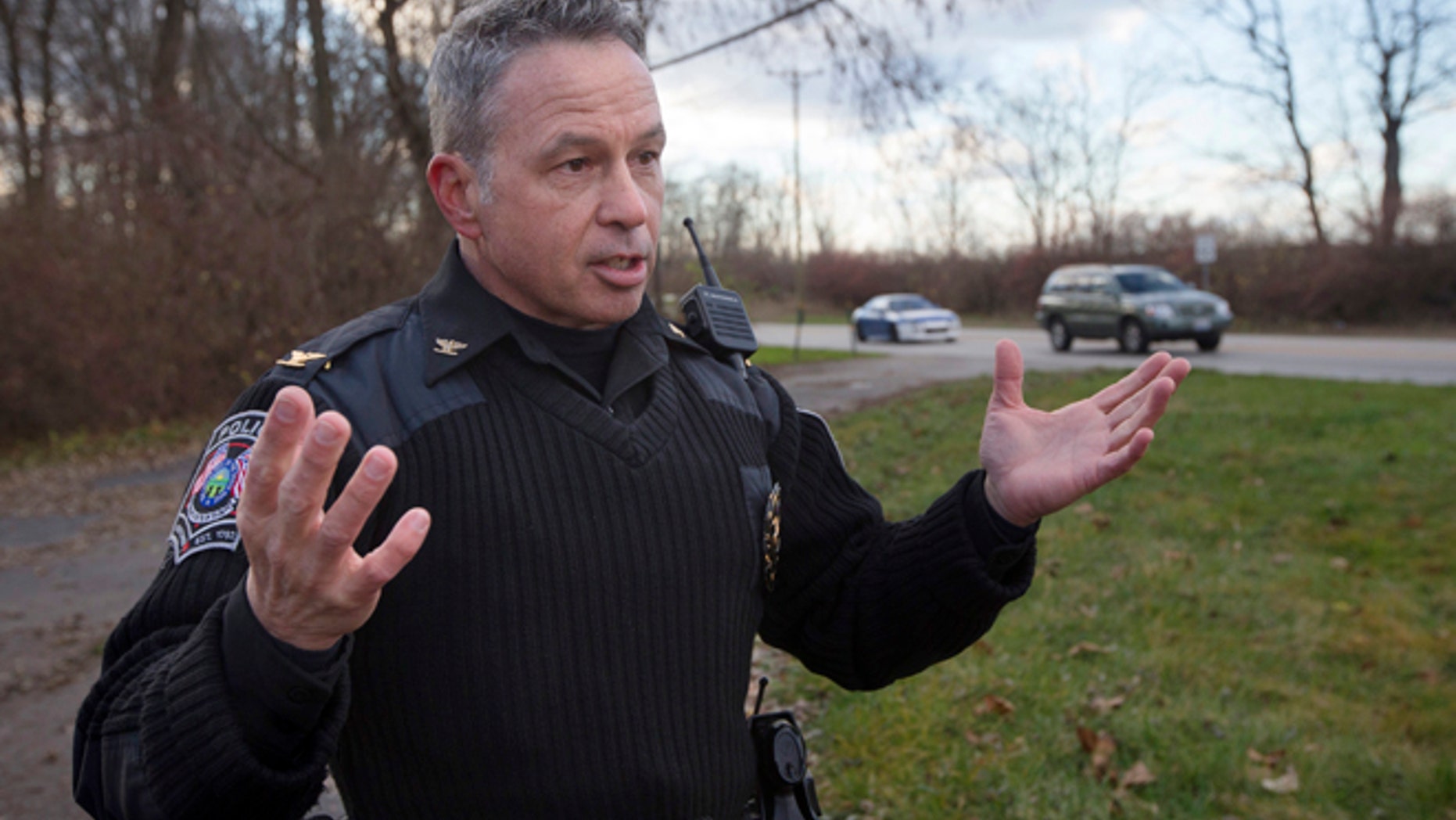 In this Dec. 18, 2015 file photo, the chief of police of the Newtown, Ohio, Police Department, Thomas Synan Jr., speaks to reporters at the scene of a traffic stop arrest in Newtown, Ohio.