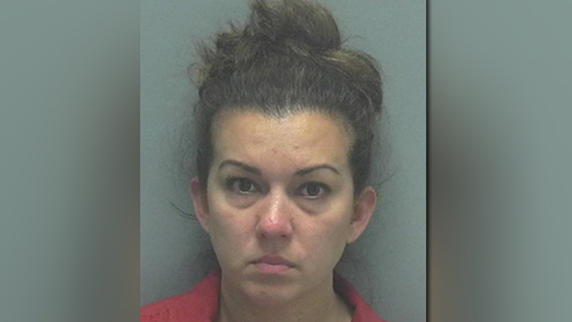 Christina Hester, 39, was seen chopping up a white powdery substance on her phone screen with a credit card while her car was parked in front of a school, authorities say.