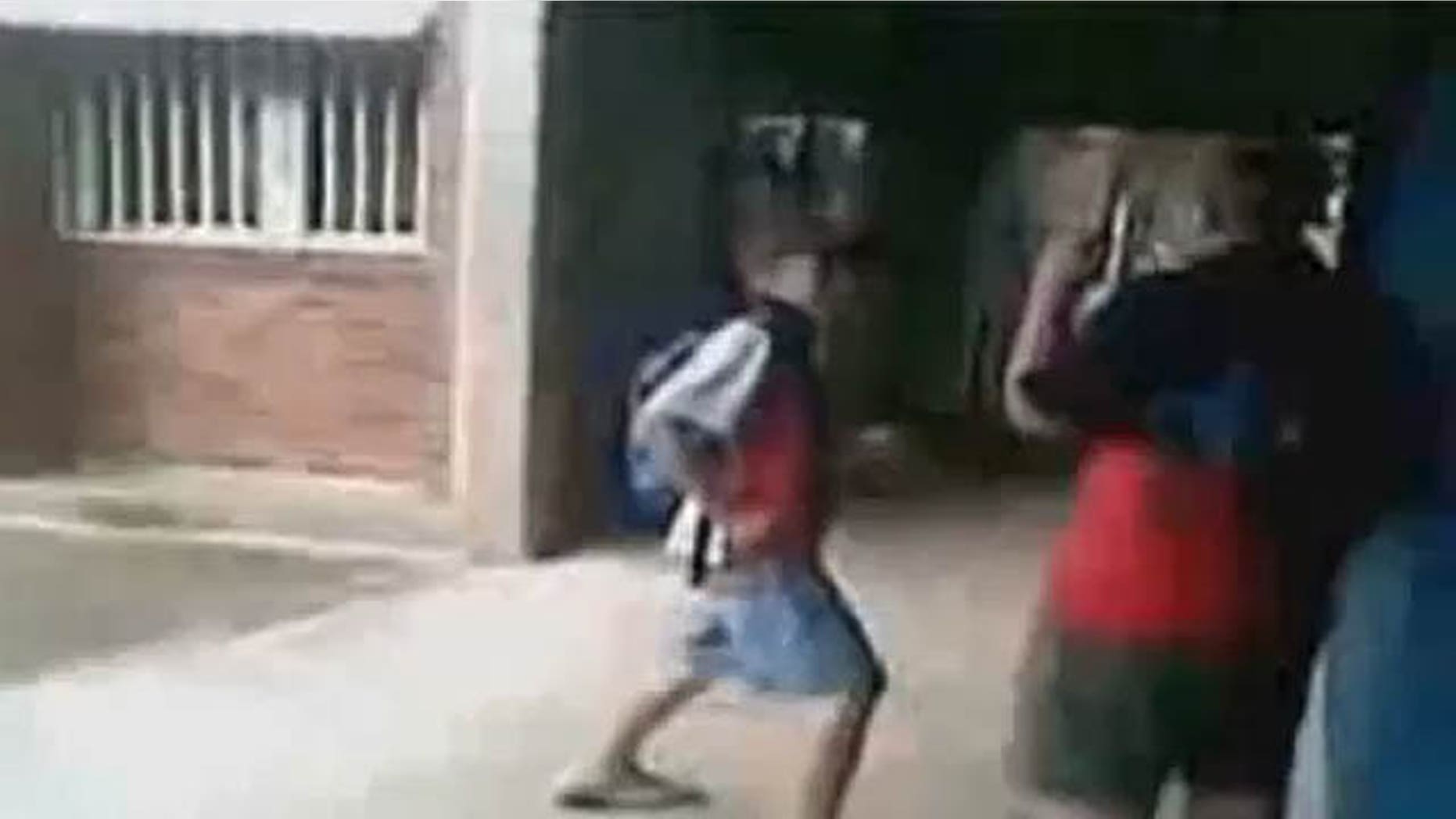 Footage of the fight shows seventh-grader Ritchard Gale, left, repeatedly tormenting, shoving and punching 10th-grader Casey Heynes at Chifley College in St. Marys North before the much-larger Heynes body slams Gale and walks away. (YouTube)