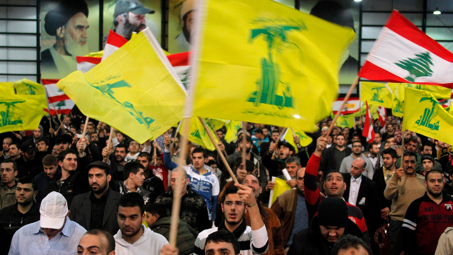 February 16, 2013 - FILE photo: Lebanon's Hezbollah supporters wave flags during a rally to commemorate Martyrs' Day in Beirut. .