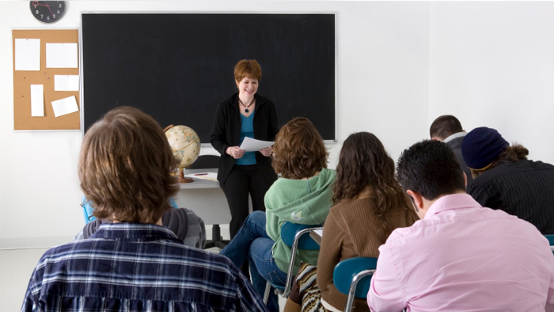 A teacher conducting a high school class.