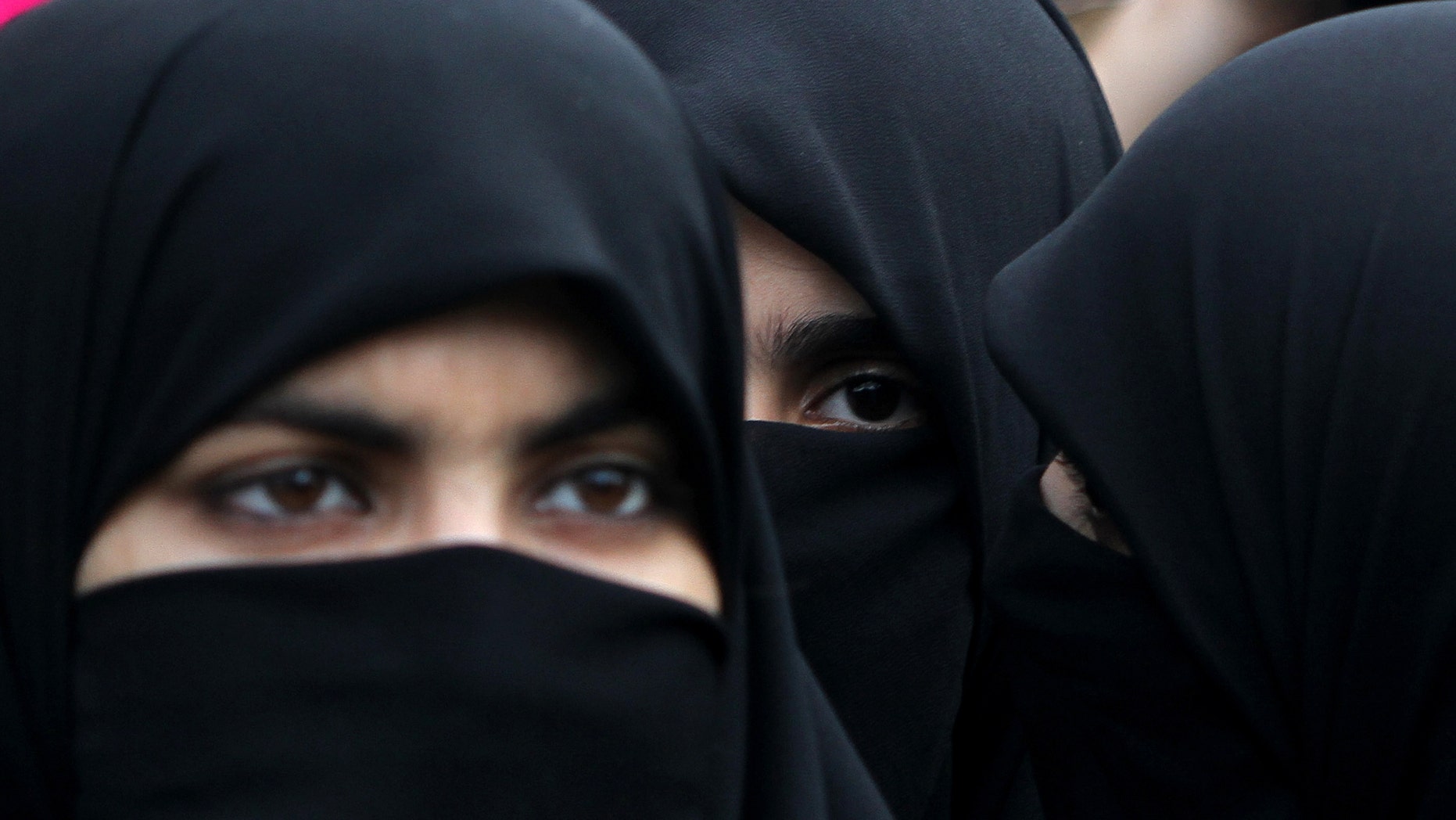 Supporters of Pakistani religious party Jamaat-e-Islami hold a rally to observe the World Hijab (veil) Day in Islamabad, Pakistan, Wednesday, Sept. 4, 2013. Scores of the party's female supporters wearing veils gathered to advocate the necessity of veil for the Muslim women. (AP Photo/B.K. Bangash)