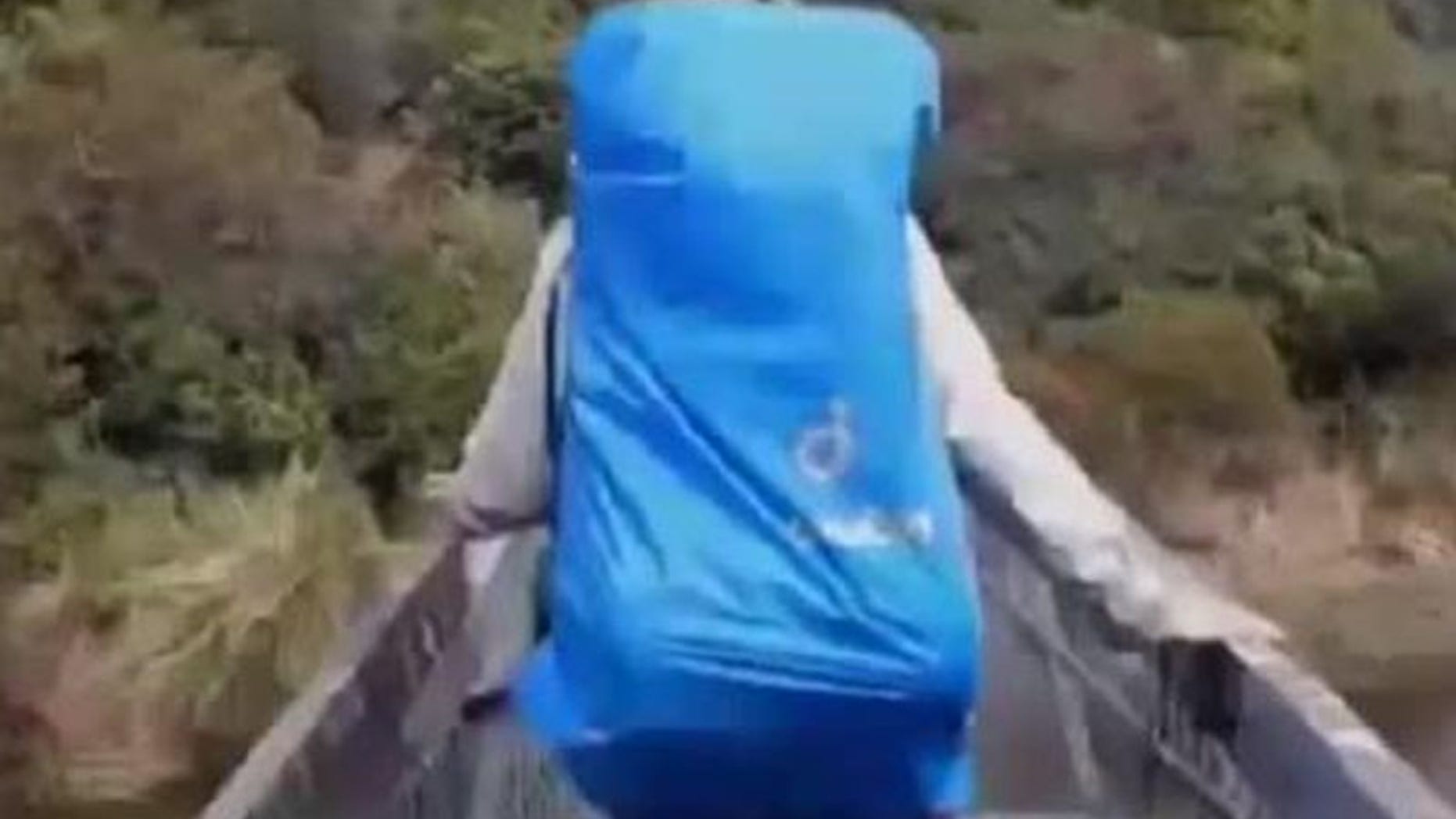 Tourists in New Zealand plunging approximately 25 feet into the water after a support cable broke on a suspension bridge they were crossing.