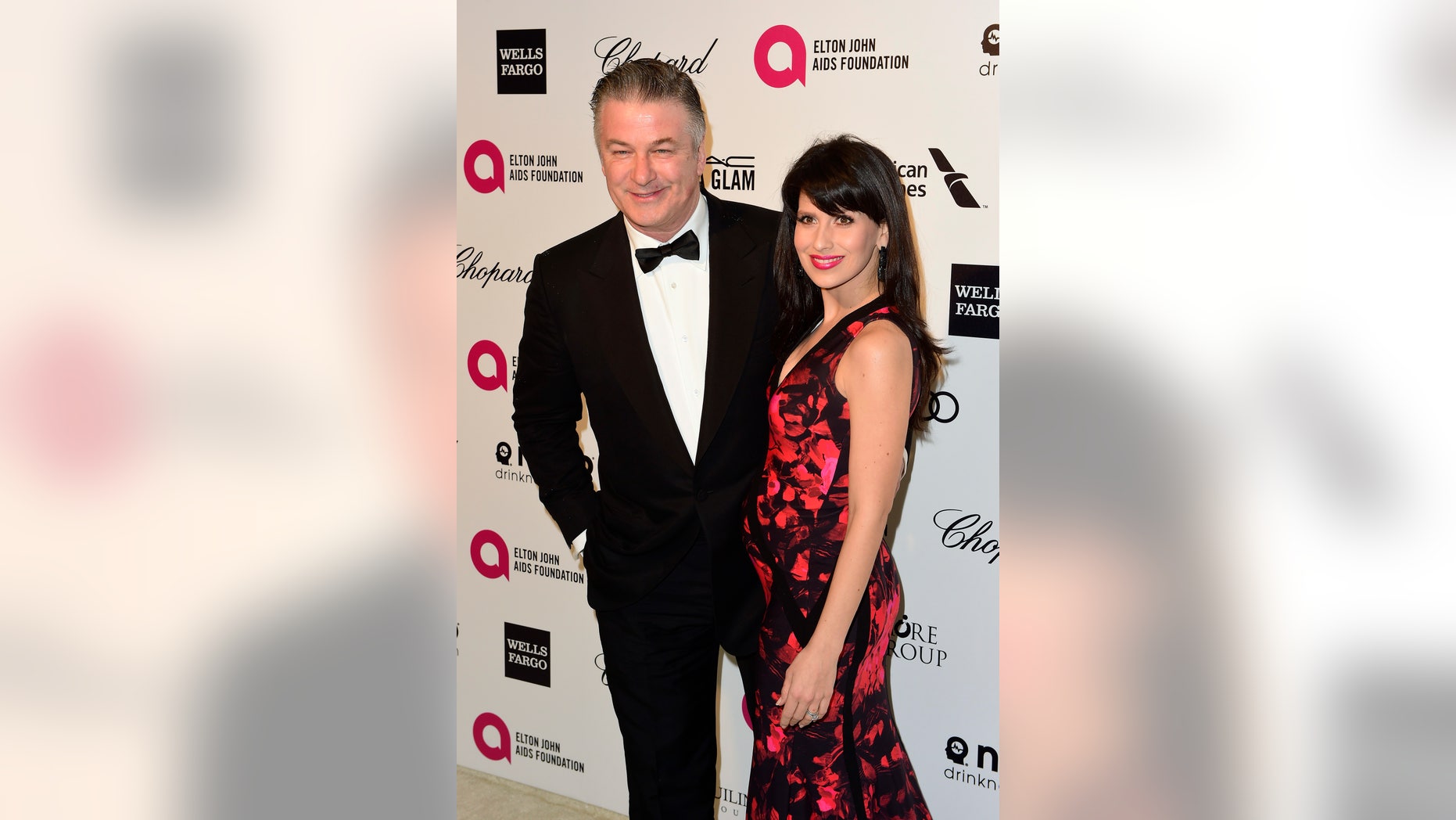 February 22, 2015. Actor Alec Baldwin and his wife Hilaria Thomas arrive at the 2015 Elton John AIDS Foundation Oscar Party in West Hollywood, California.