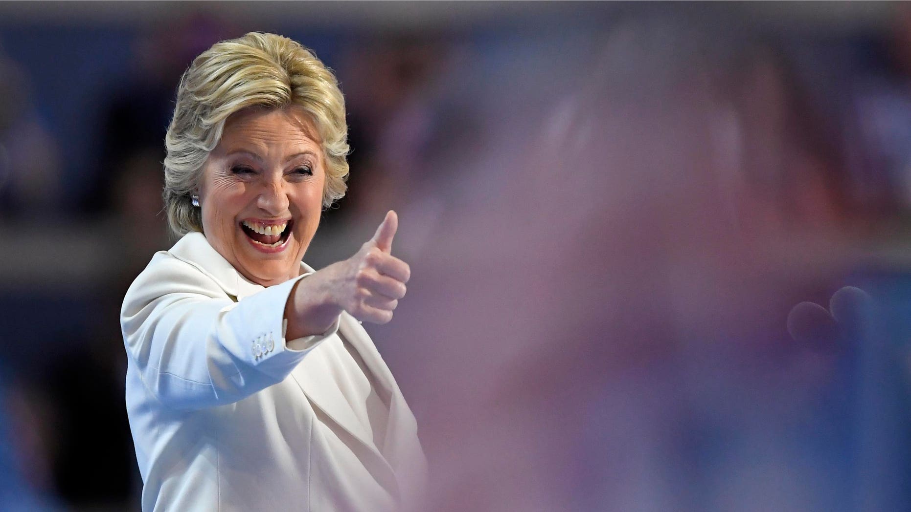Democratic presidential nominee Hillary Clinton give a thumbs up after taking the stage to make her acceptance speech during the final day of the Democratic National Convention in Philadelphia , Thursday, July 28, 2016.