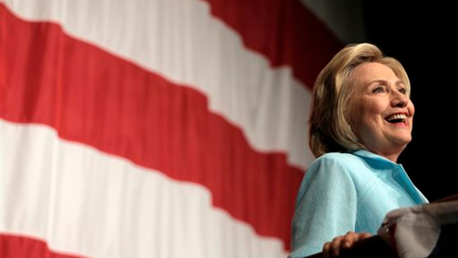 FILE- In this Aug. 14, 2015, photo, Democratic presidential candidate Hillary Rodham Clinton speaks at the at the Iowa Democratic Wing Ding at the Surf Ballroom in Clear Lake, Iowa. (AP Photo/Charlie Riedel, File)