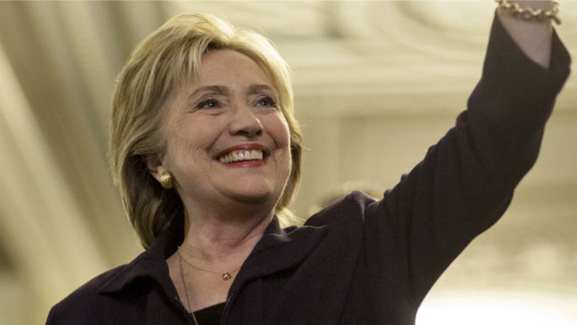 U.S. Democratic presidential candidate Hillary Clinton waves after testifying to the House Select Committee on Benghazi on Capitol Hill in Washington October 22, 2015. REUTERS/Joshua Roberts