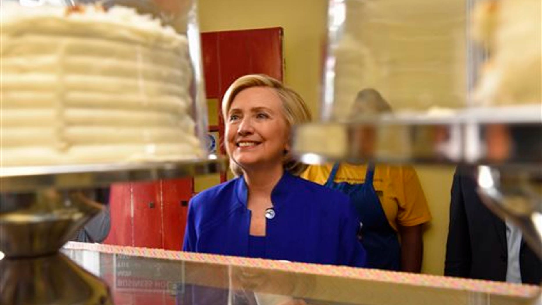 Democratic presidential candidate, former U.S. Secretary of State Hillary Rodham Clinton leaves The Main Street Bakery after speaking to Frederic Hunt, minister of the First Calvary Baptist Church, Wednesday , May 27, 2015, in Columbia, S.C. (AP Photo/Richard Shiro)