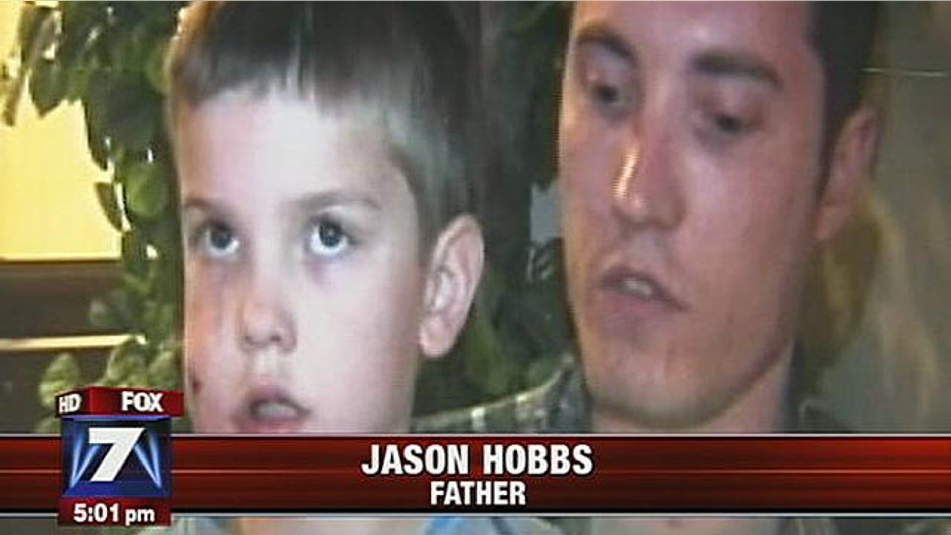 Rivers Hobbs with his father, Jason Hobbs, who stabbed the mountain lion with a pocketknife, causing it to flee.
