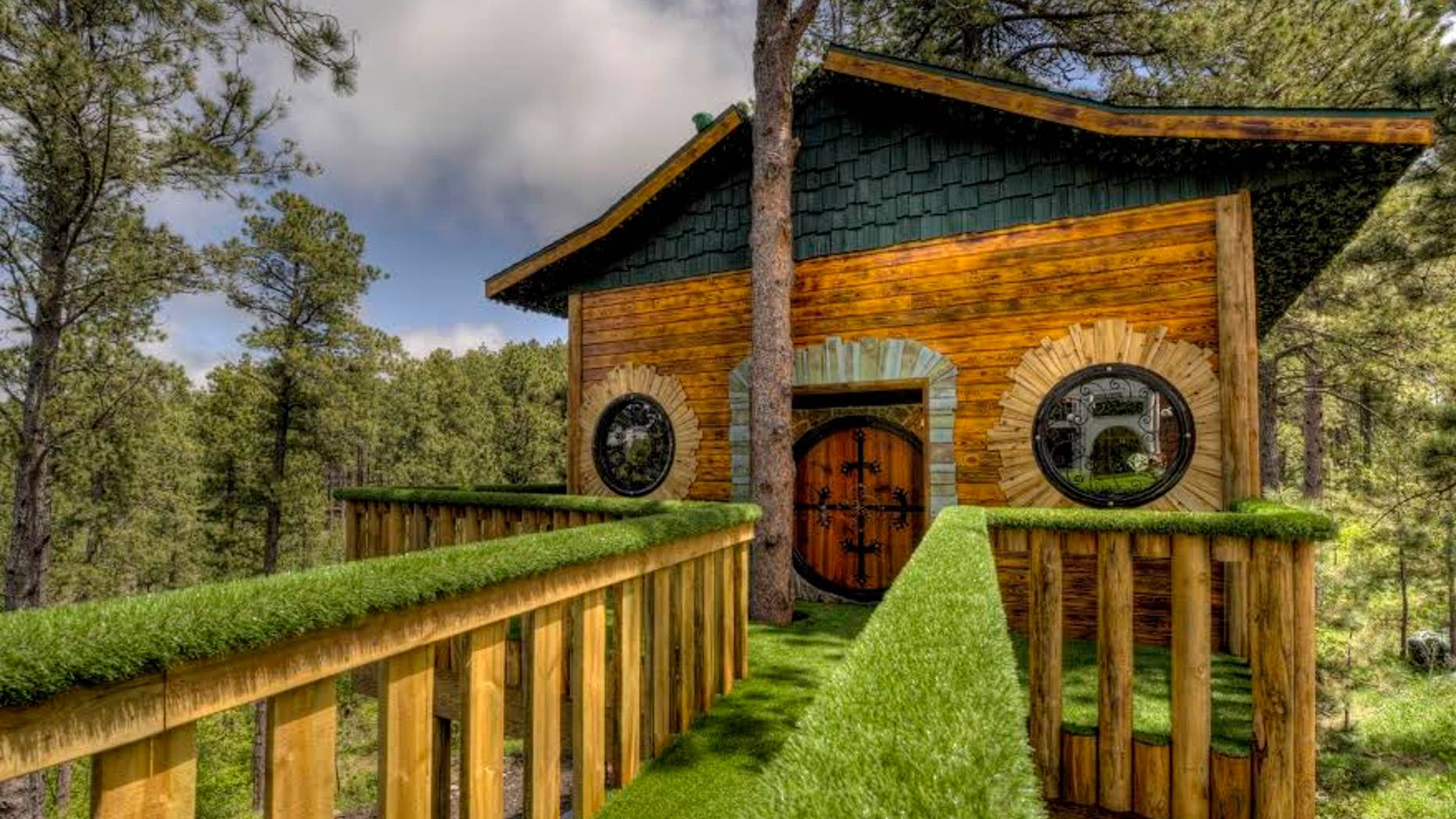 A walkway connects the original property to the Hobbit-themed treehouse.