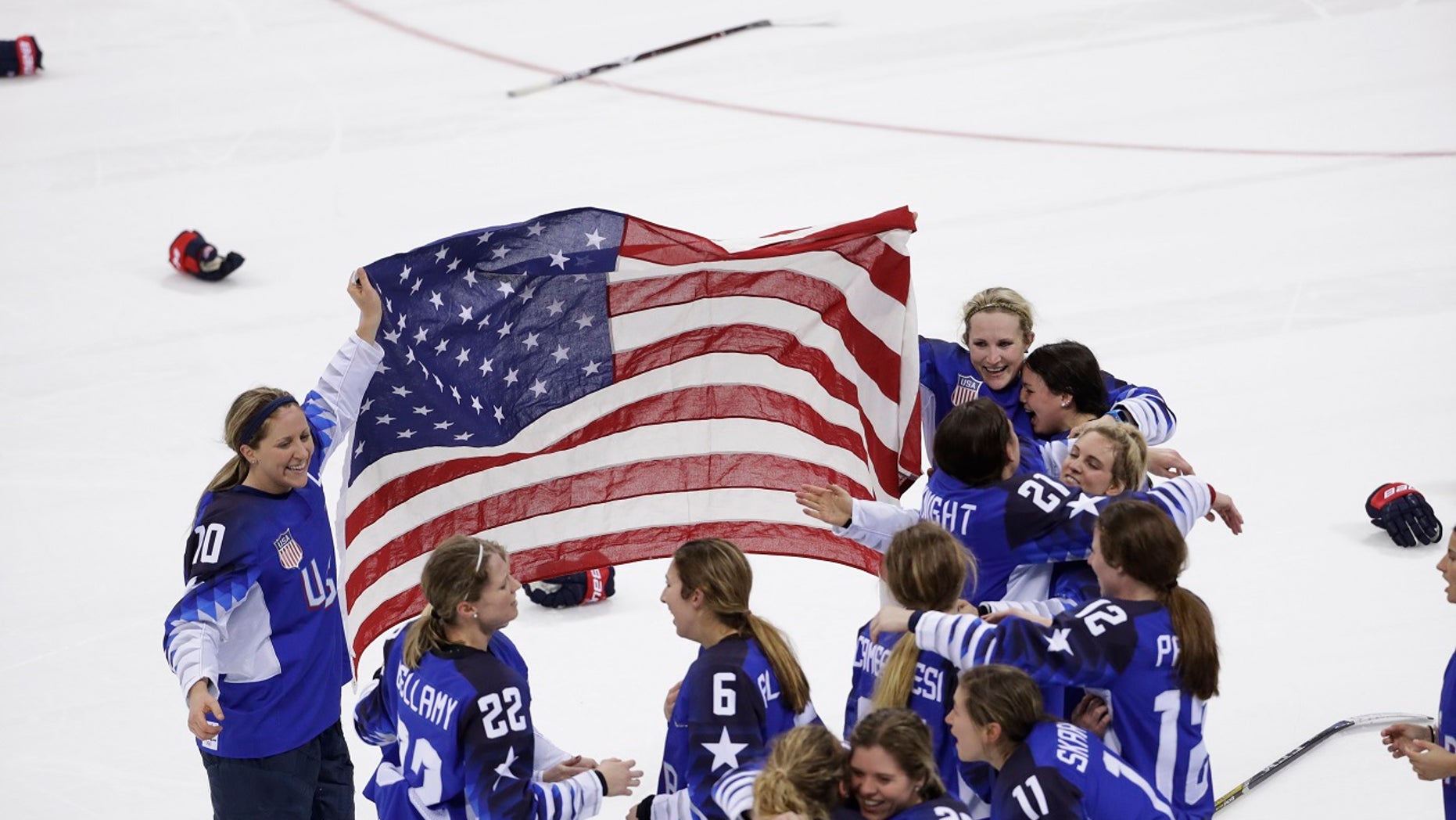 United States celebrates winning gold after the women's gold medal hockey game against Canada at the 2018 Winter Olympics in Gangneung, South Korea
