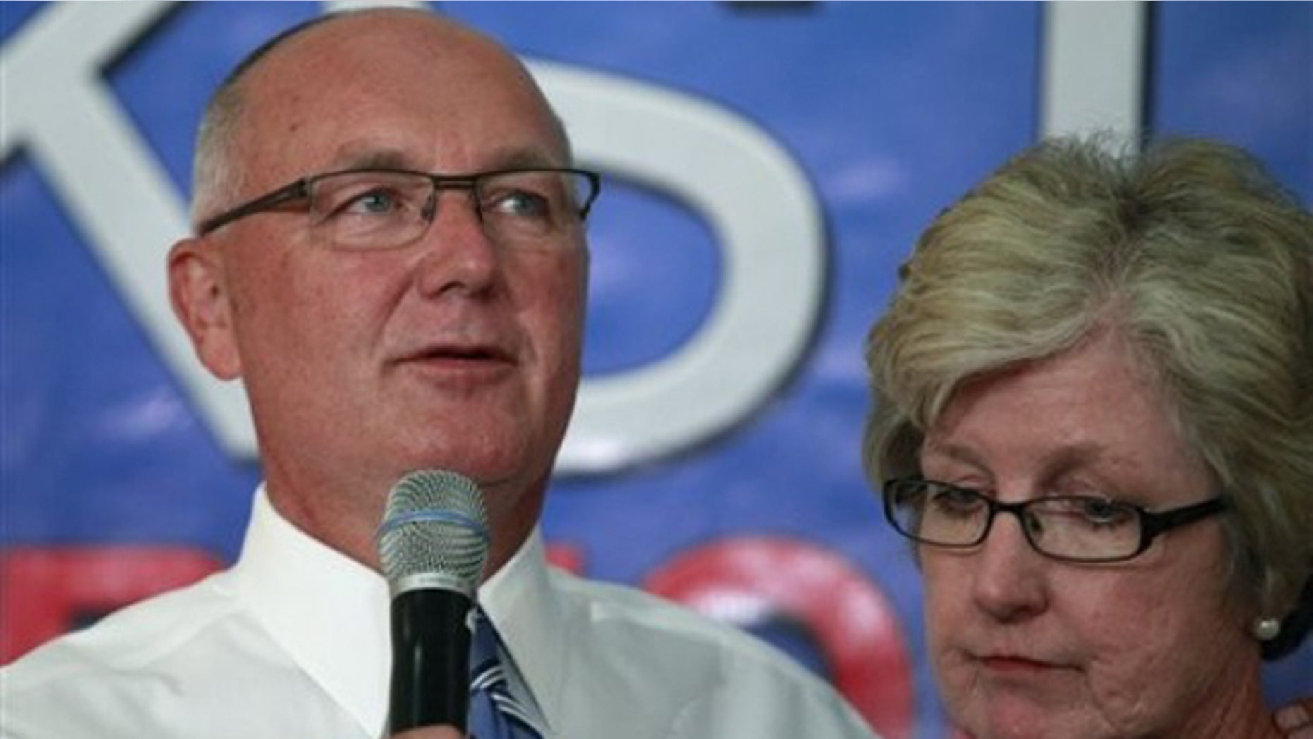 In this Aug. 3, 2010, photo, then-Rep. Pete Hoekstra stands with his wife, Diane, as he concedes during an election gathering for the Michigan gubernatorial primary in Hudsonville, Mich.