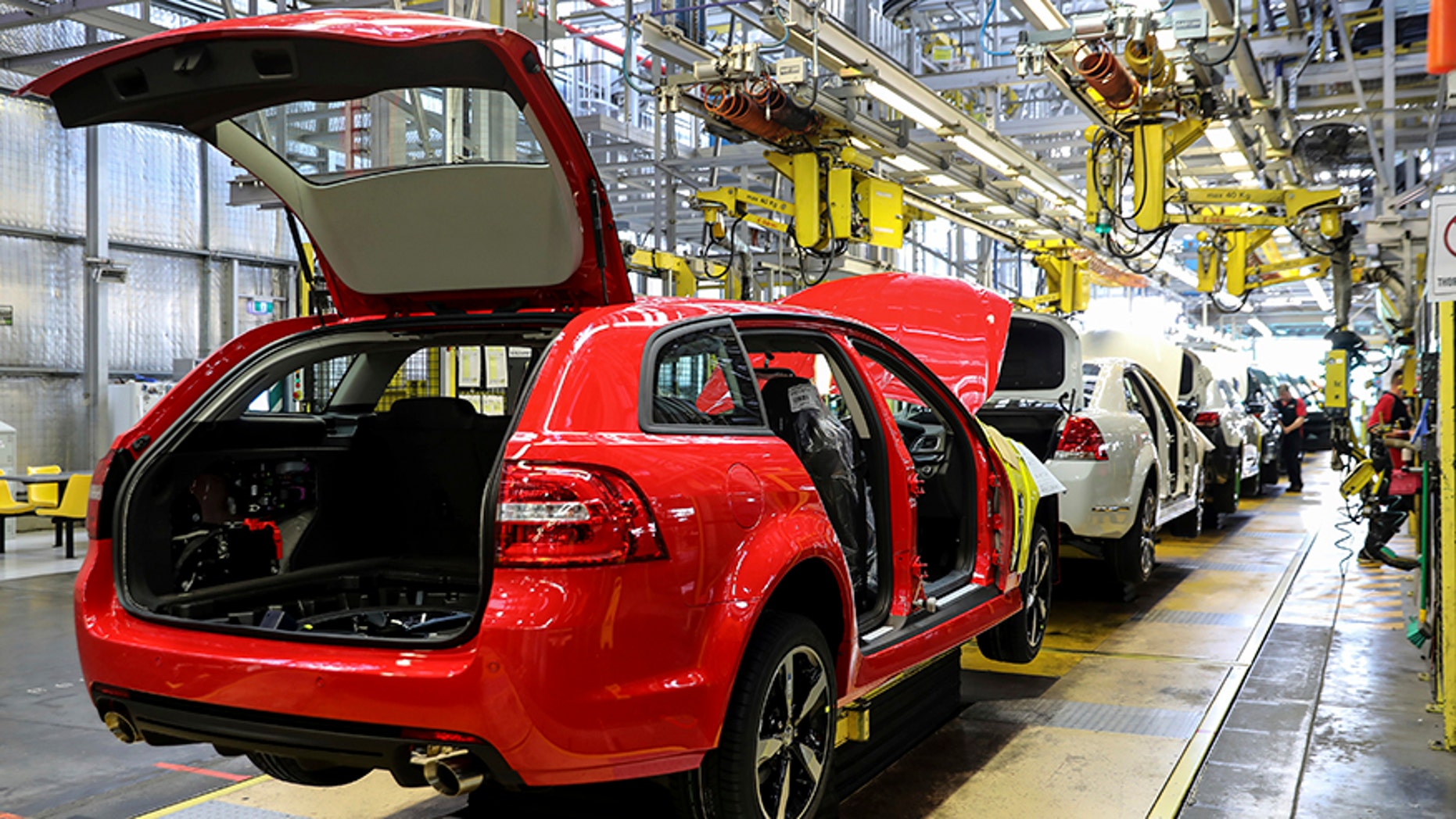 In this undated photo provided by General Motors Holden, cars are assembled on the production line in Adelaide, Australia. The Australian auto manufacturing era ends after more than 90 years on Friday, Oct. 20, 2017 when General Motors Co.'s last Holden sedan rolls off the production line in the industrial city of Adelaide. The nation has already begun mourning the demise of a home-grown industry in an increasing crowded and changing global car market. (General Motors Holden via AP)