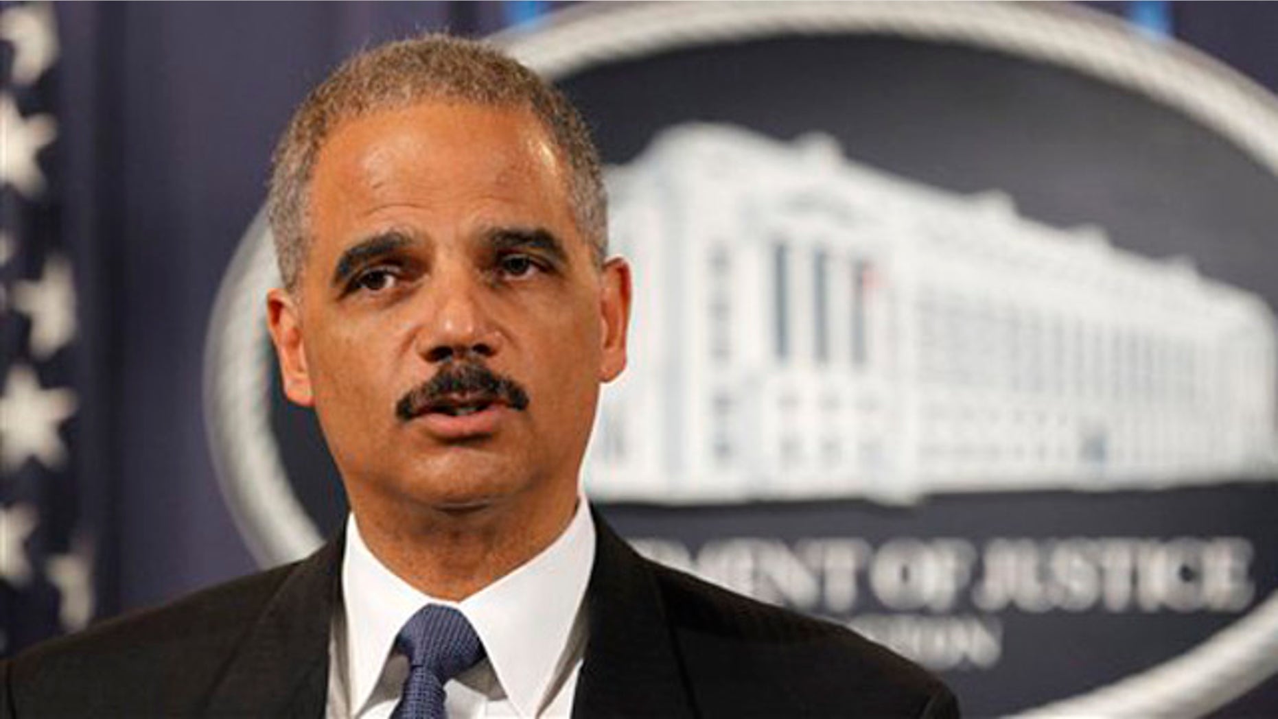 Attorney General Eric Holder speaks during a news conference at the Justice Department in Washington Oct. 11.