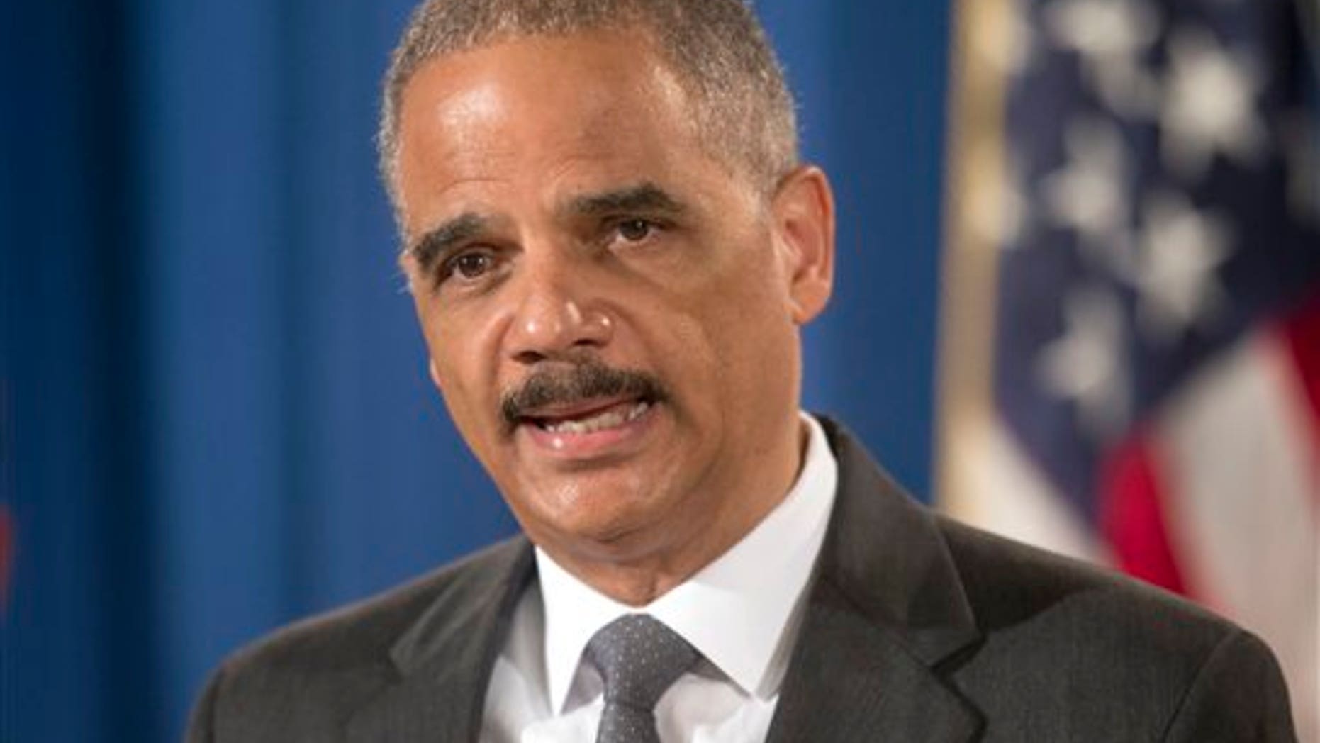 Attorney General Eric Holder announces at the Justice Department in Washington Monday, July 14, 2014, that Citigroup will pay $7 billion to settle an investigation into risky subprime mortgages. (AP Photo/Pablo Martinez Monsivais)