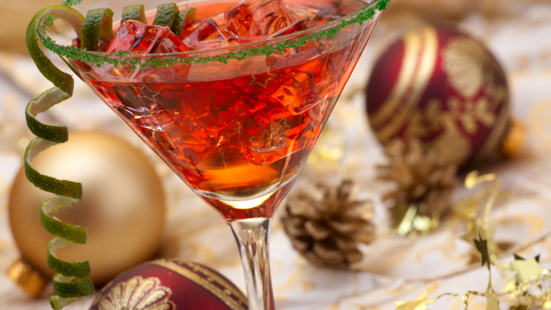 Glass of Christmas Cocktail in martini glass and Christmas ornaments