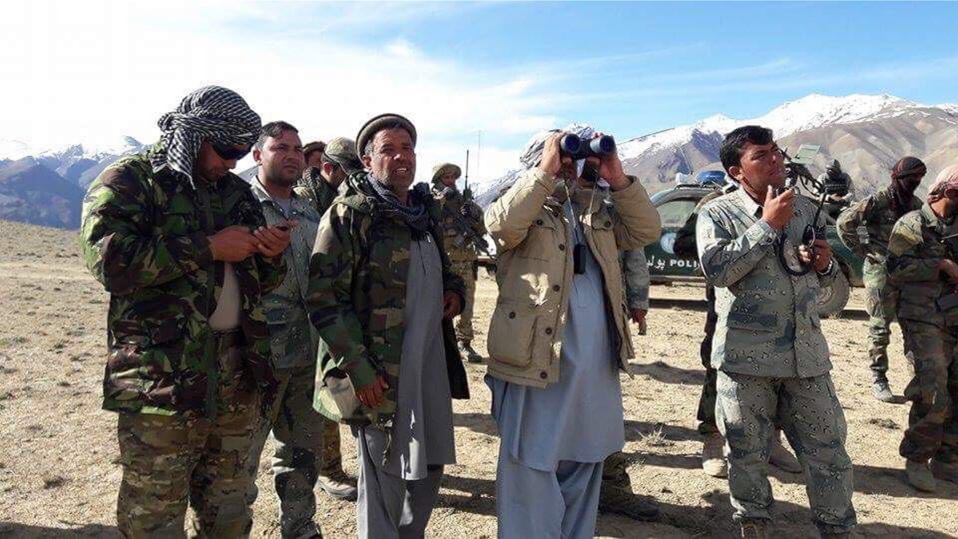 From the frontlines in Ishkashim. Commanding Officer Col. Mohammad Nader is the one second to the left in army jacket and gray Afghan dress.