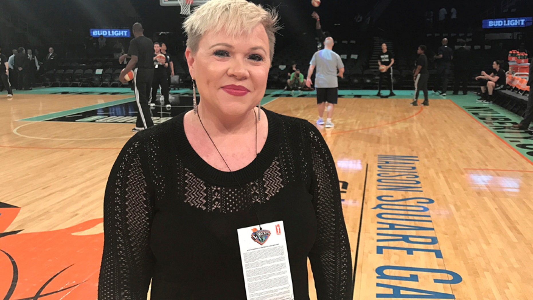 Holly Rowe stands on the court at Madison Square Garden in New York before a WNBA basketball game between the New York Liberty and the Minnesota Lynx, Thursday, May 18, 2017.