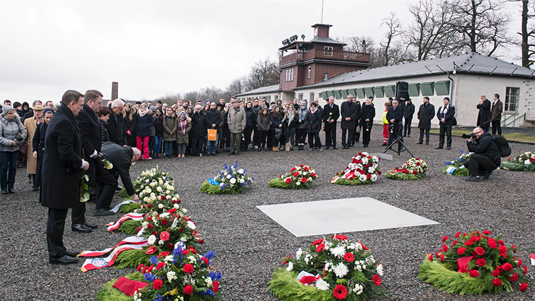 People mourn on occasion of the international Holocaust remembrance day (Jan.27) in the former Nazi concentration camp Buchenwald near Weimar, Germany, Friday.