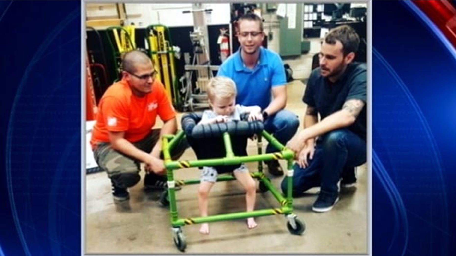 Silus Johnson, 2, tries out brand-new, custom-made walker built by some North Texas Home Depot employees. (Fox4 Dallas)