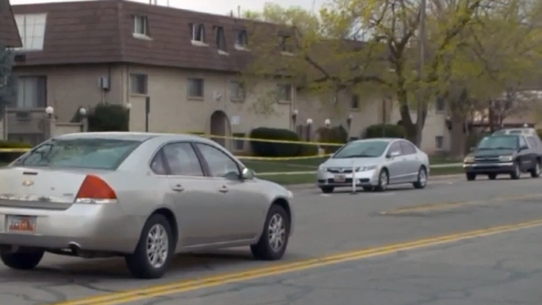 Police say a resident inside these Salt Lake City apartments shot and killed an intruder.