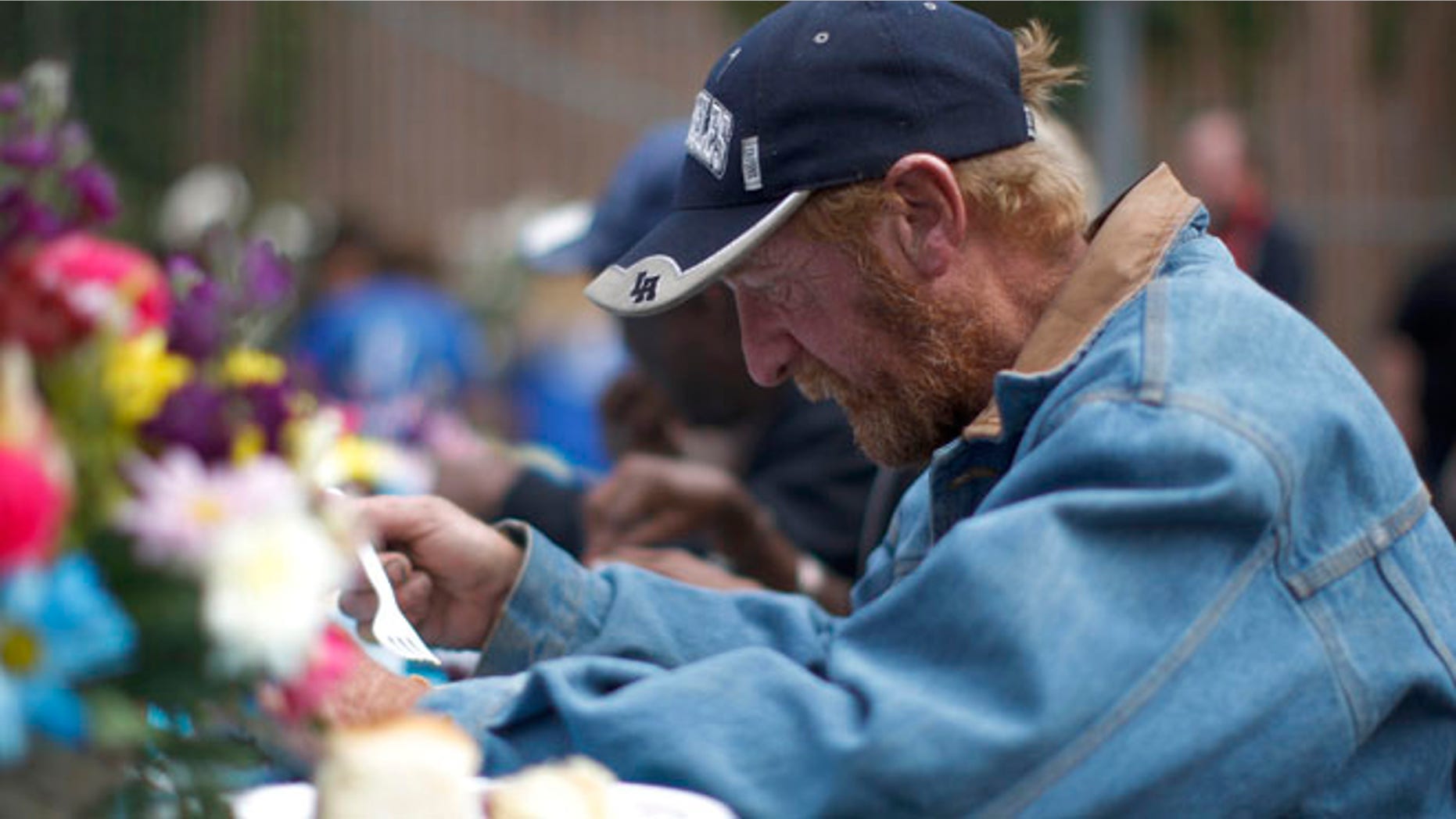 April 18, 2014: A man receives a meal at an event to help the homeless and near-homeless of Skid Row.