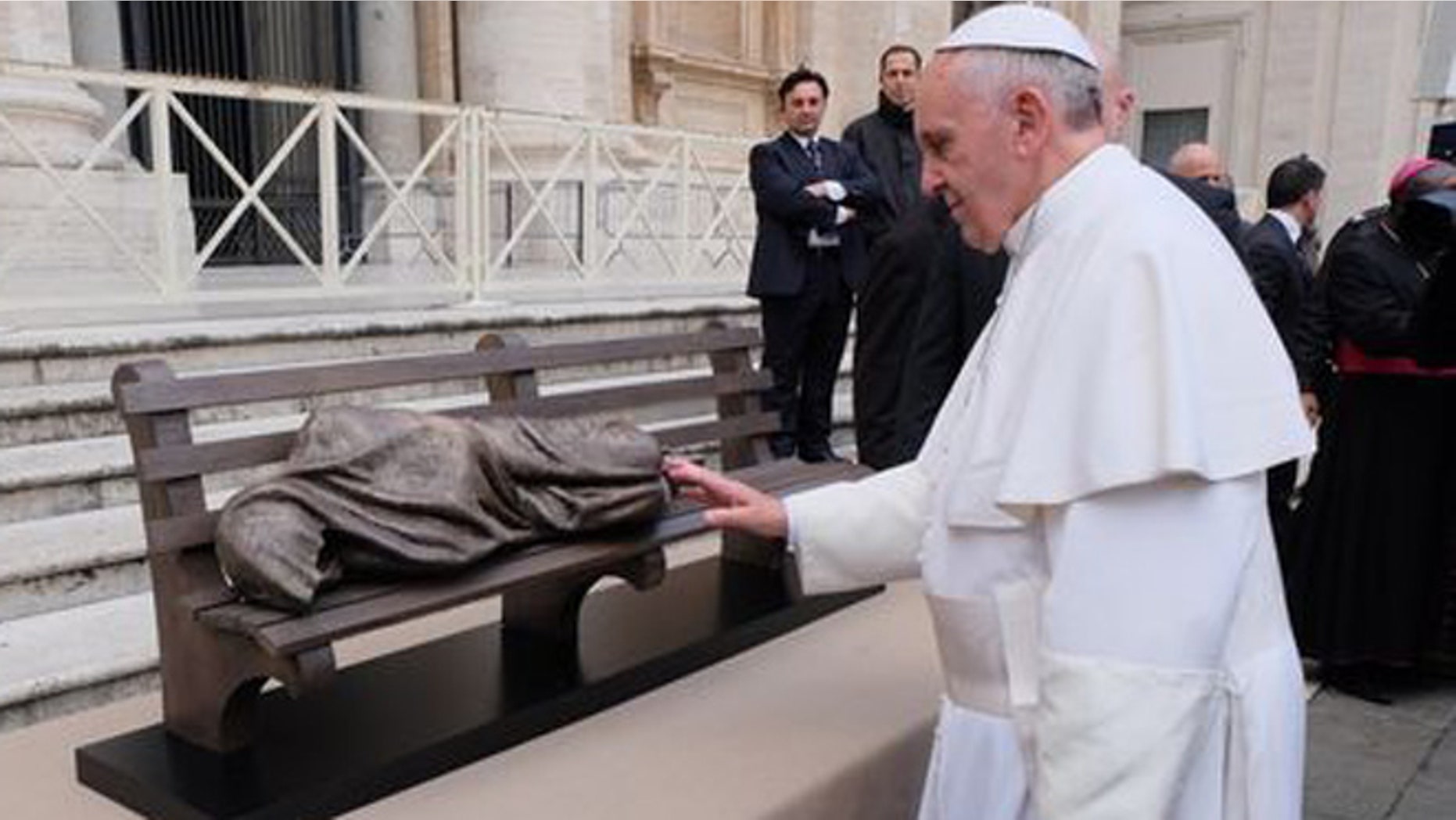 Pope Francis is presented 'Homeless Jesus' statue to Pope Francis at the Vatican last year.